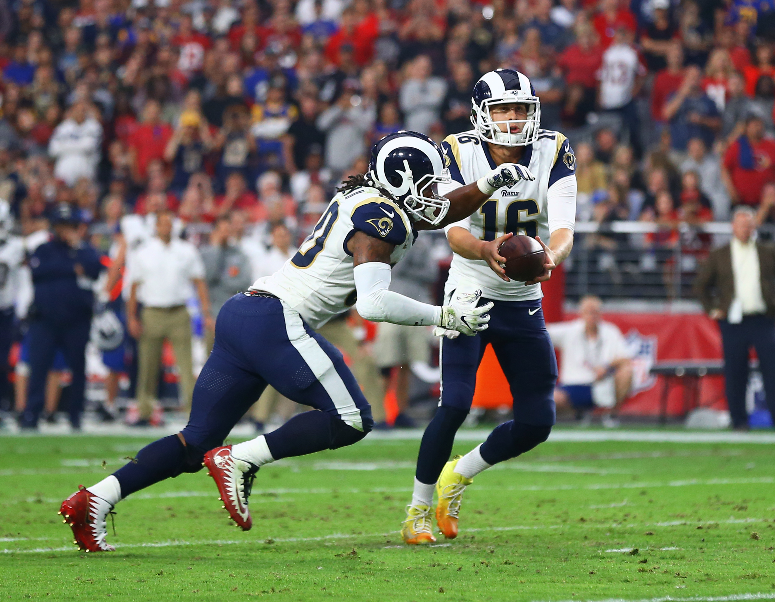 Los Angeles Rams QB Jared Goff hands the ball to RB Todd Gurley in Week 13 against the Arizona Cardinals, December 3, 2017.