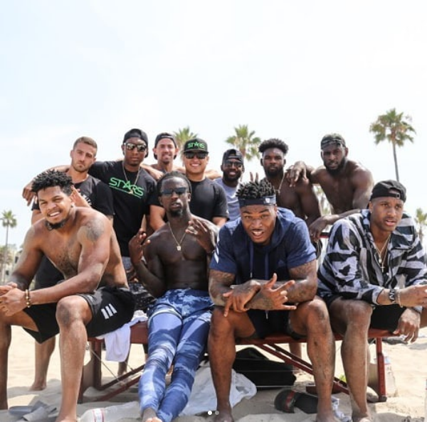LOS ANGELES, CA - New Orleans Saints first round pick Marcus Davenport (bottom, far left) poses for a group photo after a beachfront training session with other NFL rookies including Arizona Cardinals quarterback Josh Rosen (top, far left), Carolina Panth
