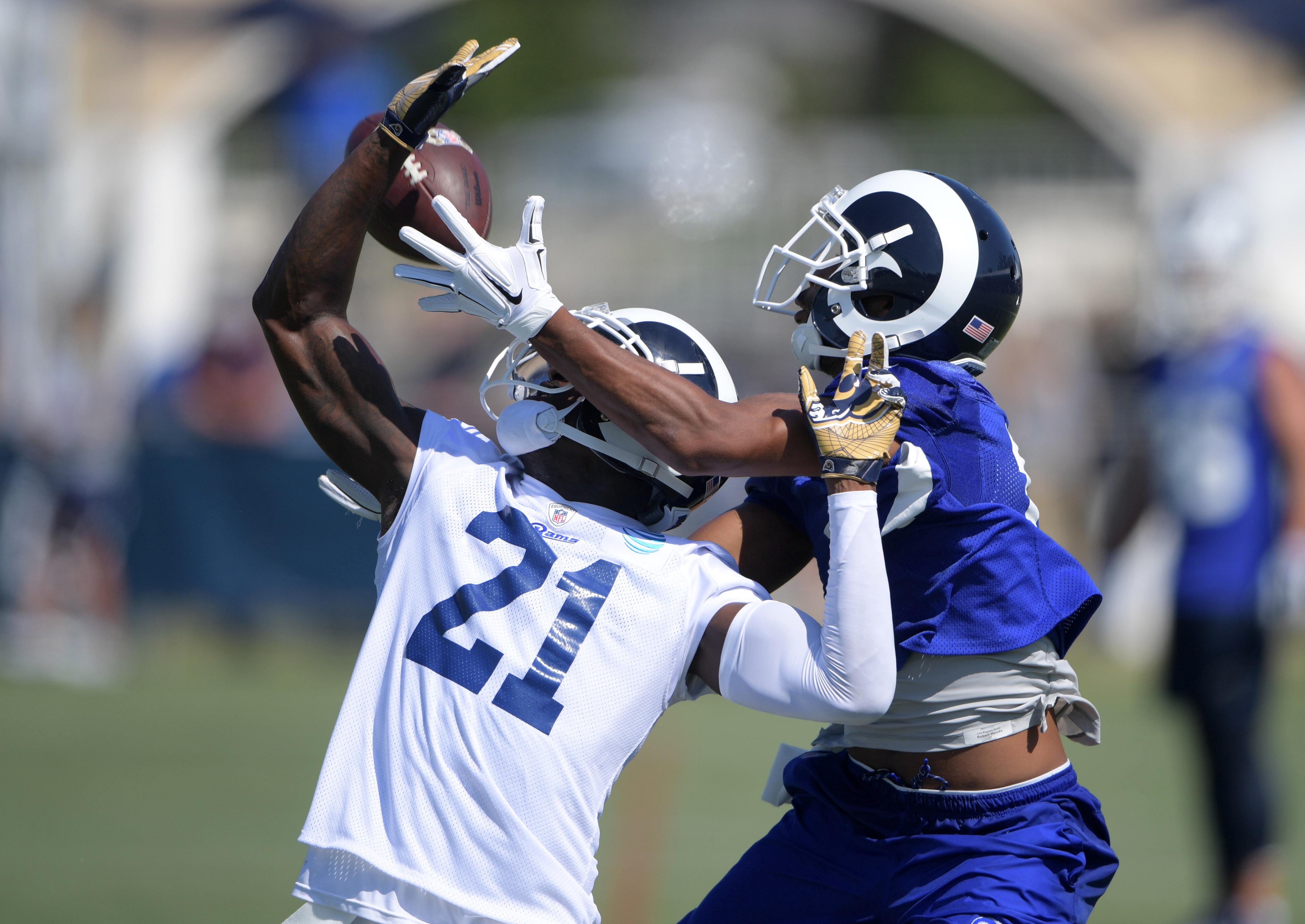 Los Angeles Rams WR Robert Woods tries to bring in a pass against former Rams CB Kayvon Webster during training camp, July 30, 2017.