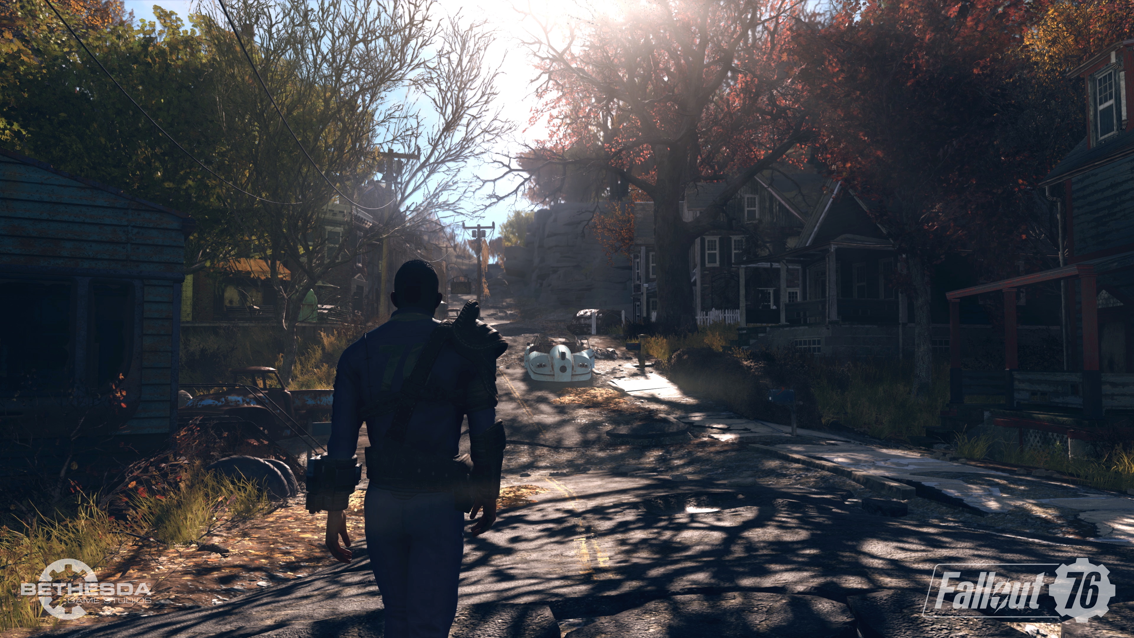 Fallout 76 - walking down a tree-lined street