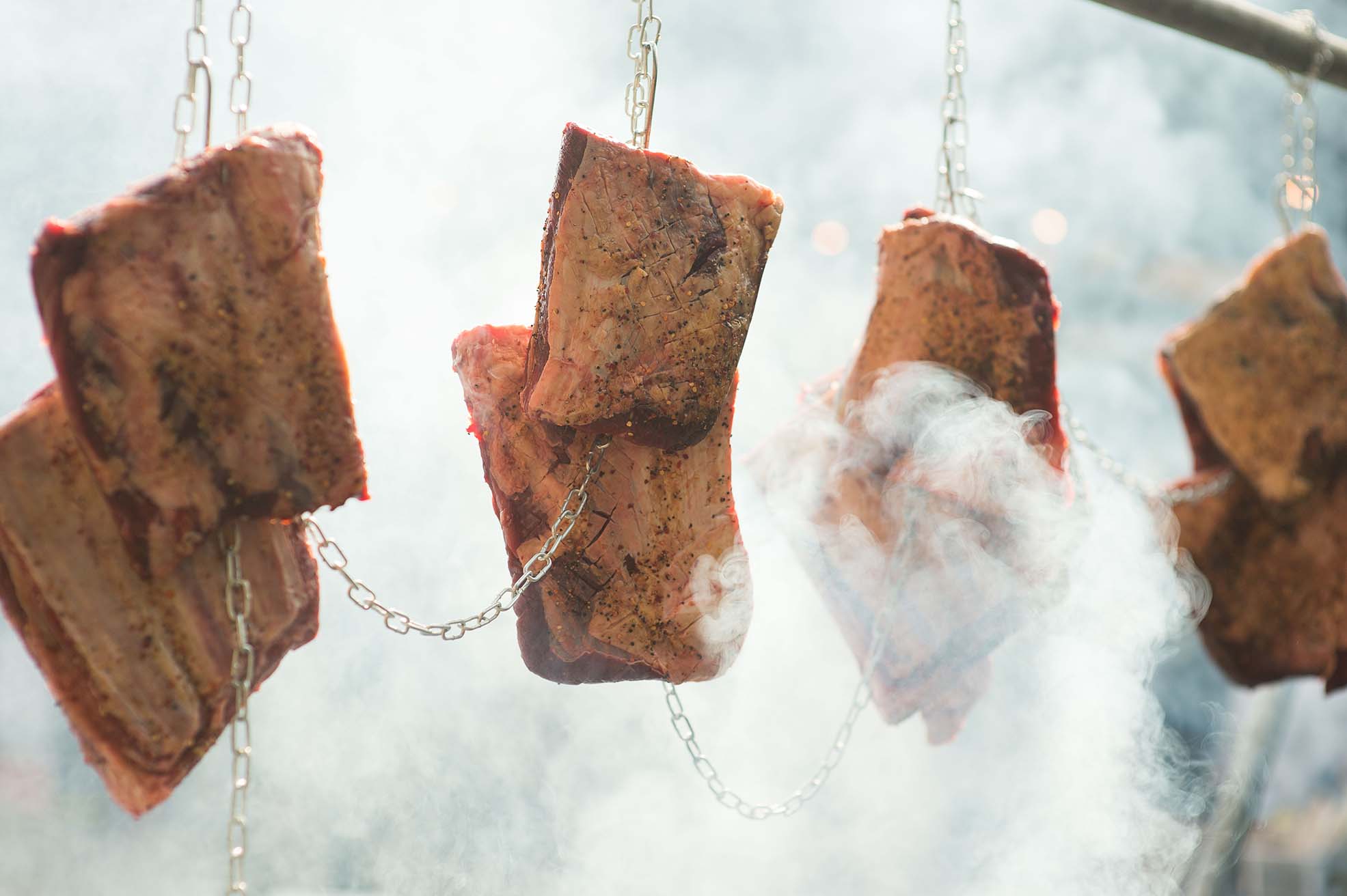 Hanging beef over fire at Meatopia UK 2018, a London food festival that dominated Instagram this week