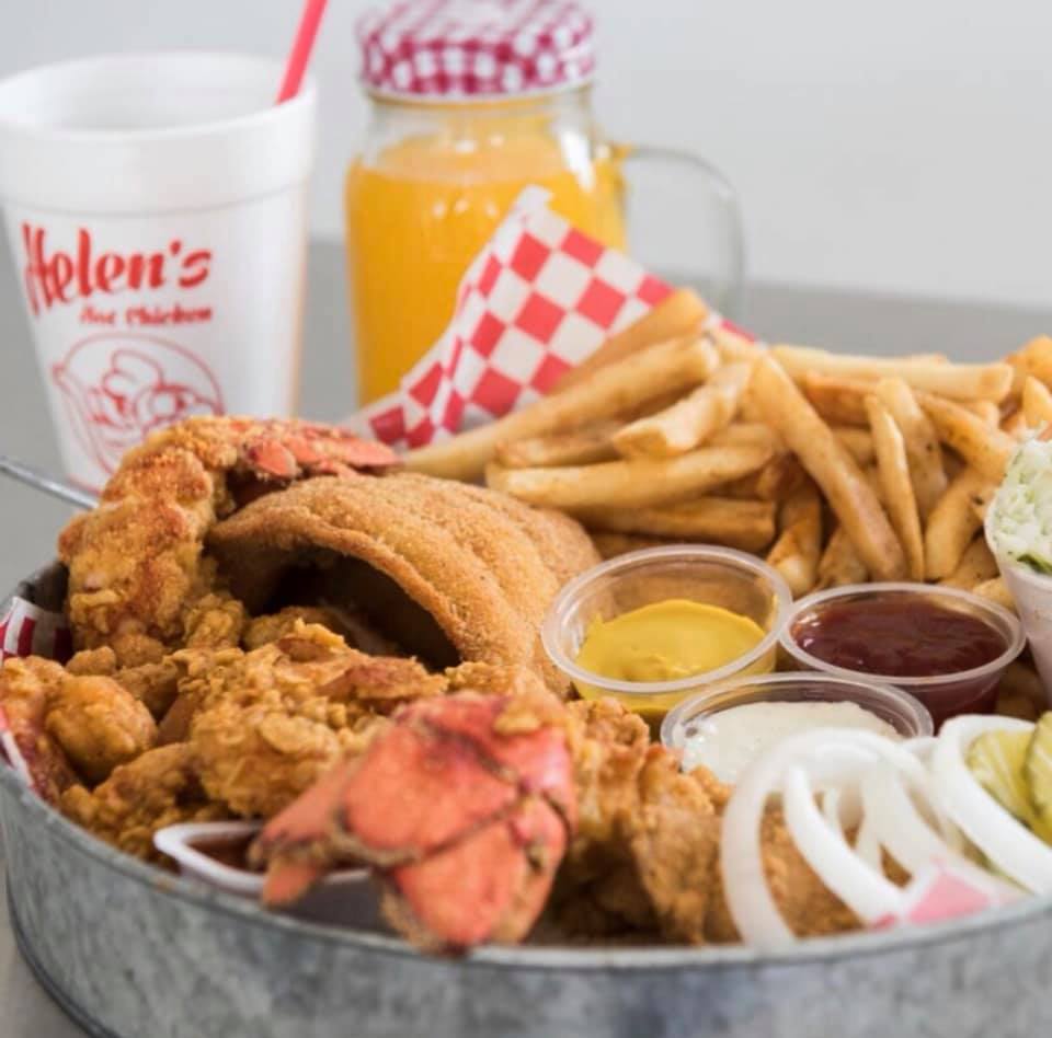 A fried fish platter with fries and drink from Helen’s Hot Chicken