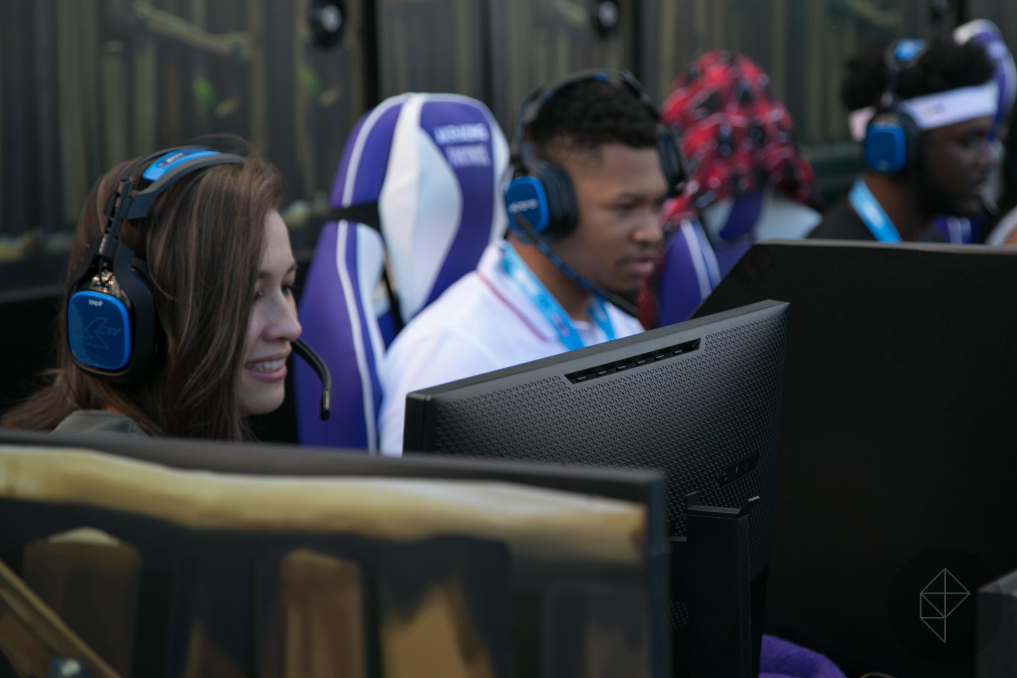 woman and man seated at computers during Fortnite Pro-Am 2016 tournament