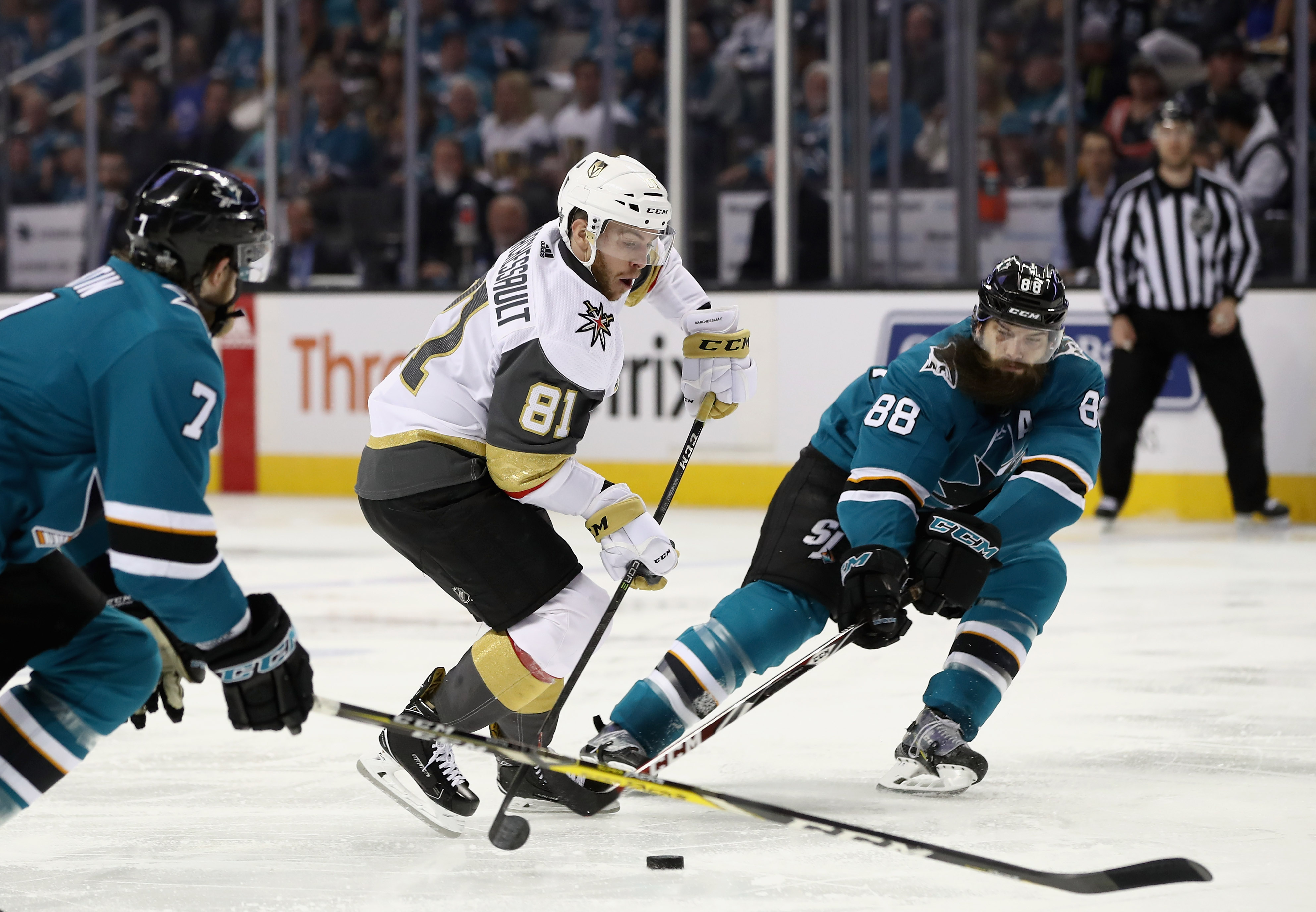 SAN JOSE, CA - APRIL 30: Jonathan Marchessault #81 of the Vegas Golden Knights tries to skate between Brent Burns #88 and Paul Martin #7 of the San Jose Sharks during Game Three of the Western Conference Second Round during the 2018 NHL Stanley Cup Playof