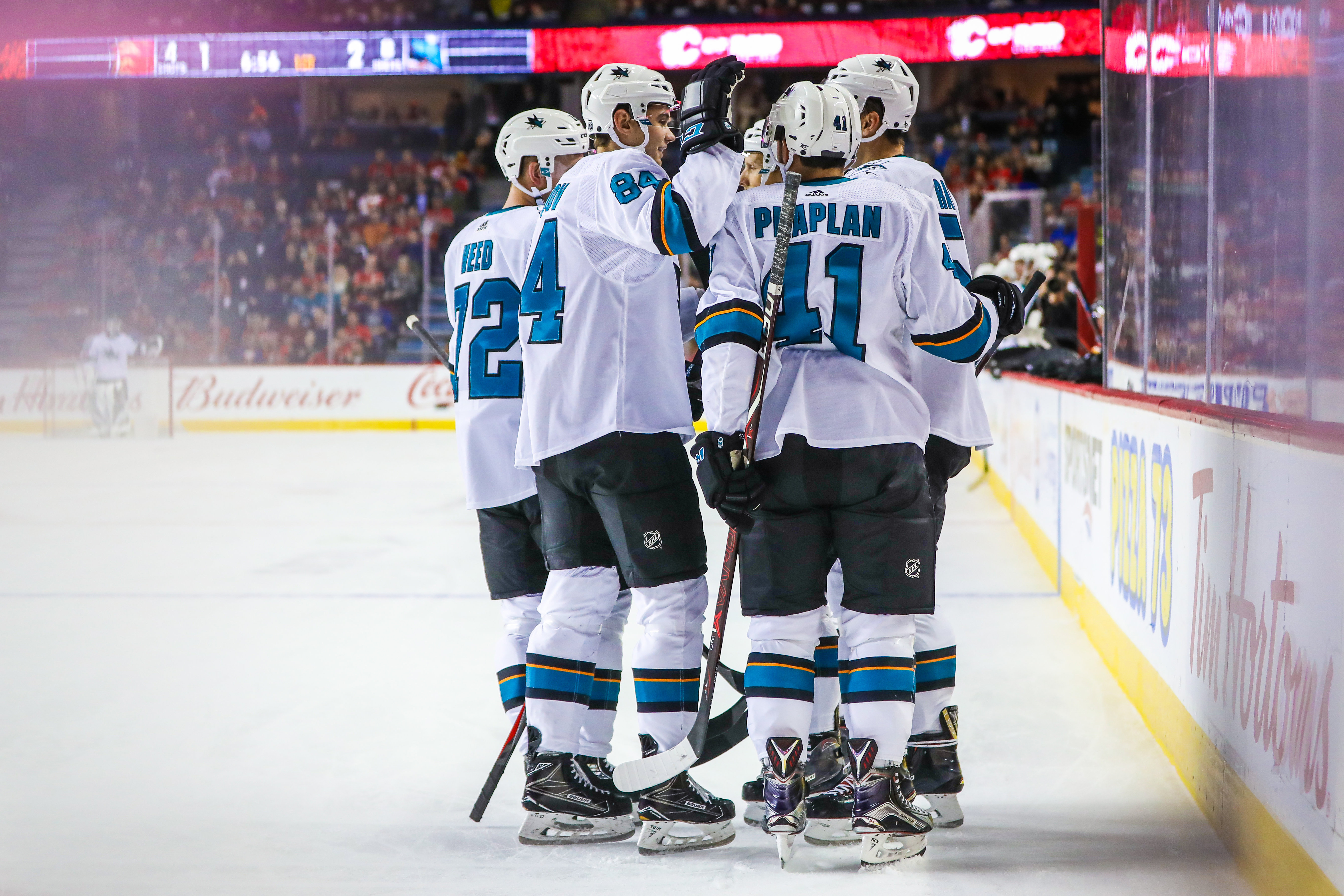 Sep 25, 2018; Calgary, Alberta, CAN; San Jose Sharks center Lukas Radil (52) celebrates his goal with teammates against the Calgary Flames during the first period at Scotiabank Saddledome.