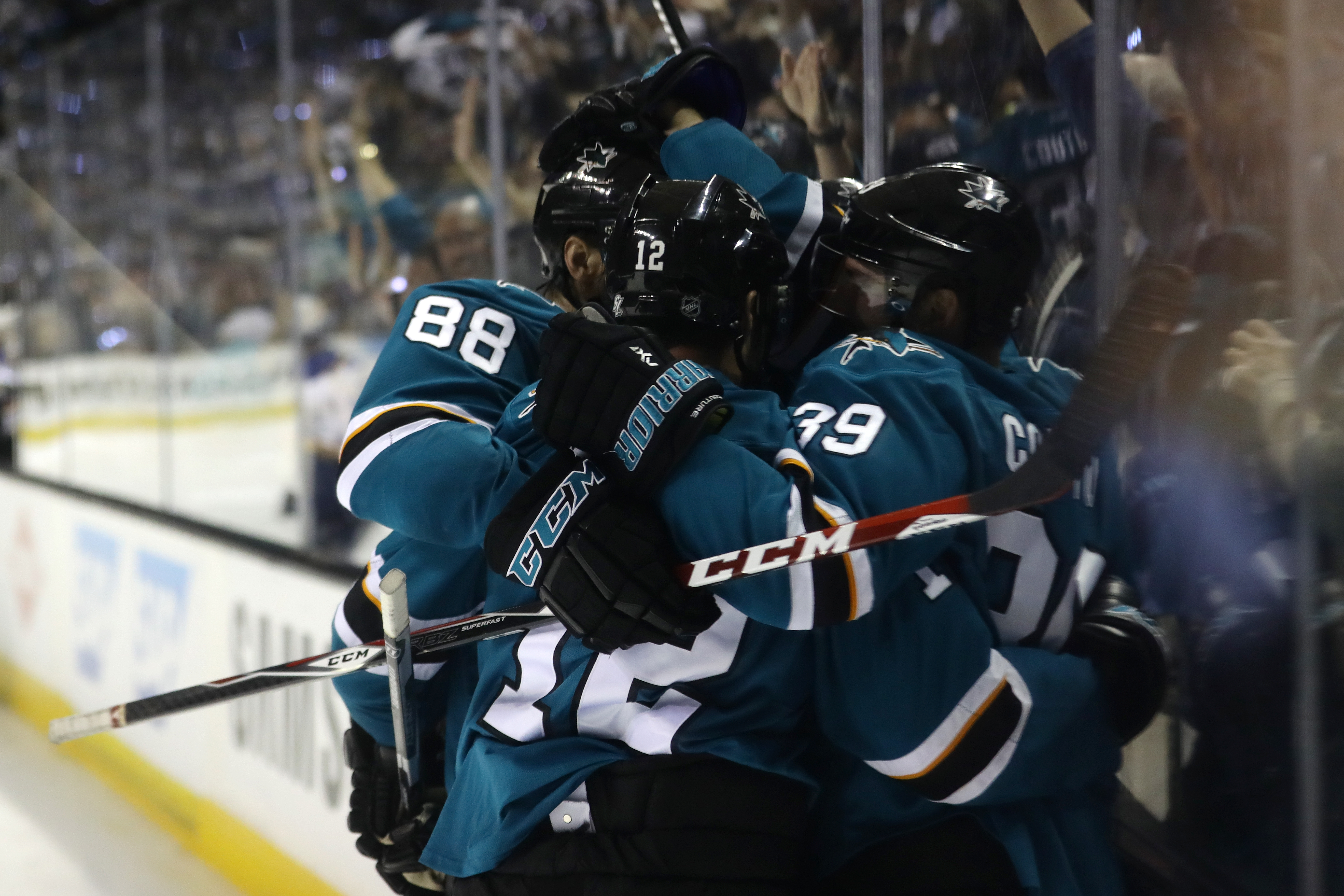 SAN JOSE, CA - MAY 25: Joonas Donskoi #27 of the San Jose Sharks celebrates with Brent Burns #88, Patrick Marleau #12 and Logan Couture #39 after scoring in Game Six of the Western Conference Final against the St. Louis Blues during the 2016 NHL Stanley C