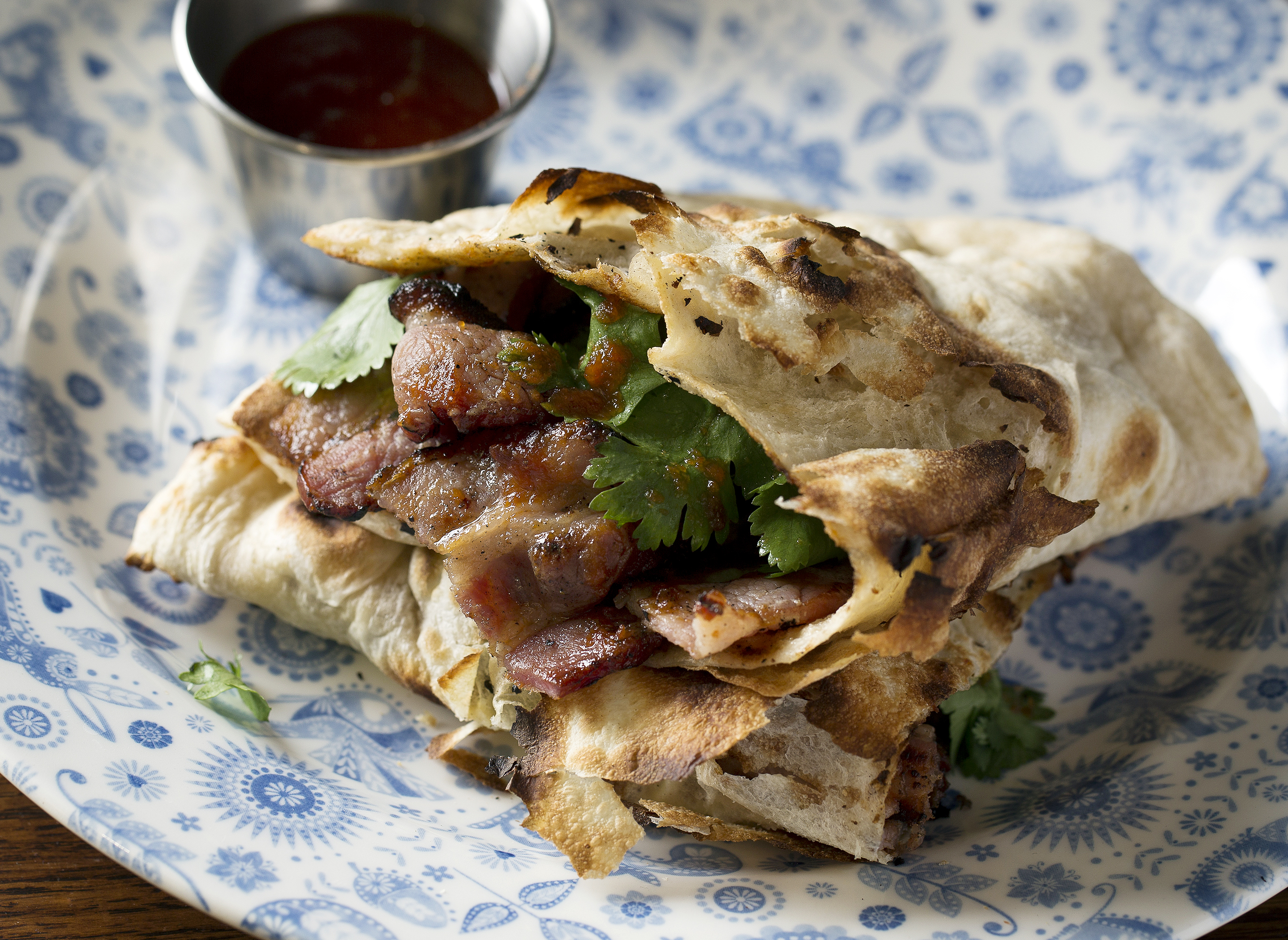 Bacon naan at Dishoom Carnaby Street in Soho — the popular Indian cafe chain will launch its first cookbook with Bloomsbury UK this year