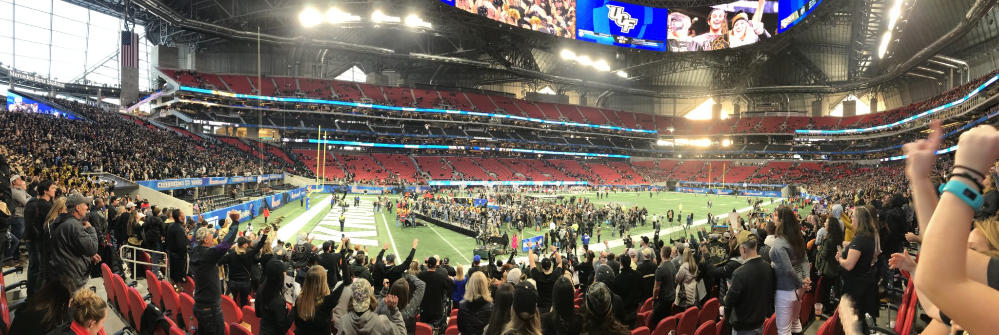 UCF fans celebrate their Knights defeating Auburn in the 2018 Chick-fil-a Peach Bowl at Mercedes-Benz Stadium in Atlanta. (Photo: Jeff Sharon)