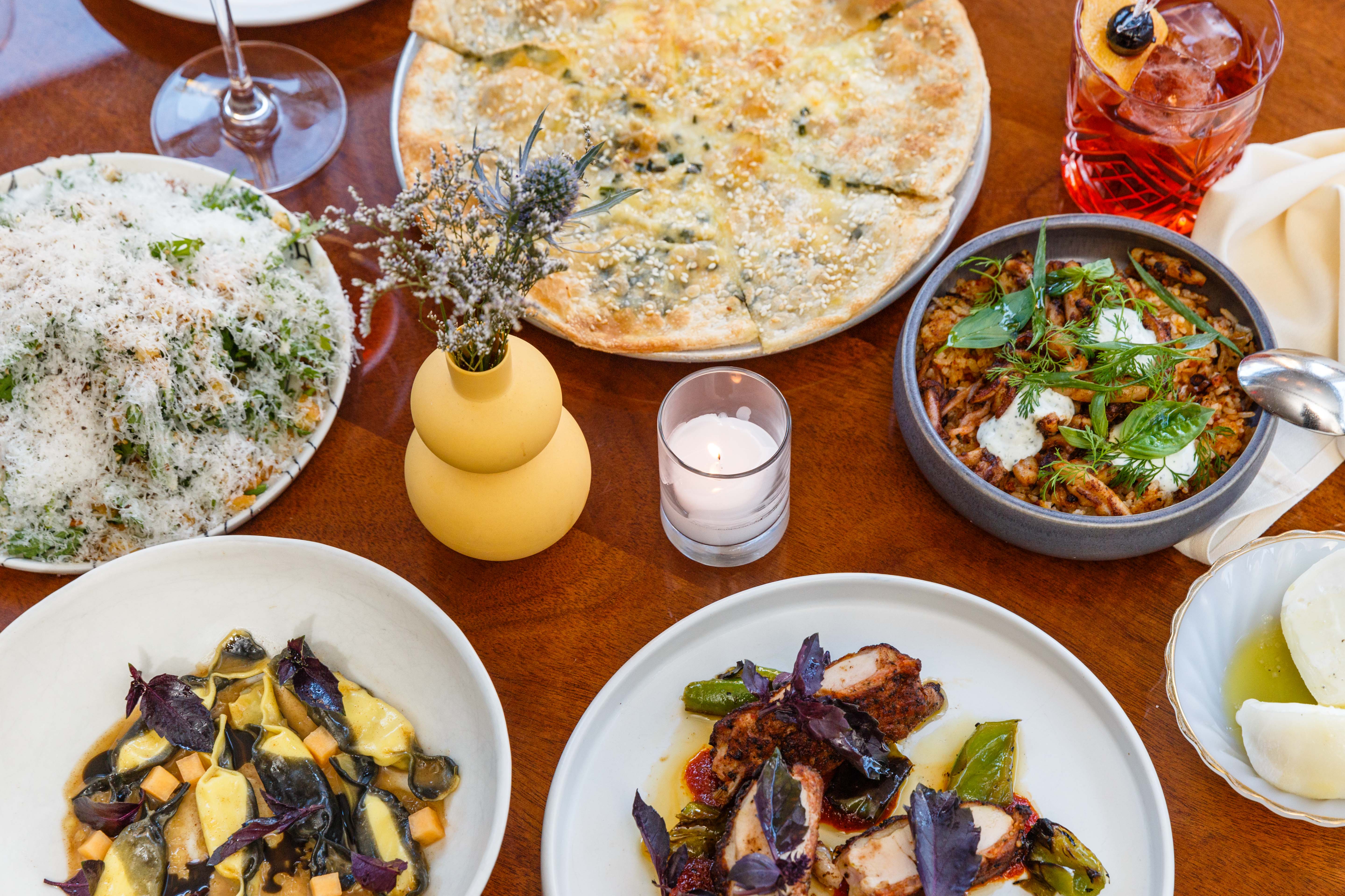 A spread of Italian-American dishes arranged on a table at Don Angie.
