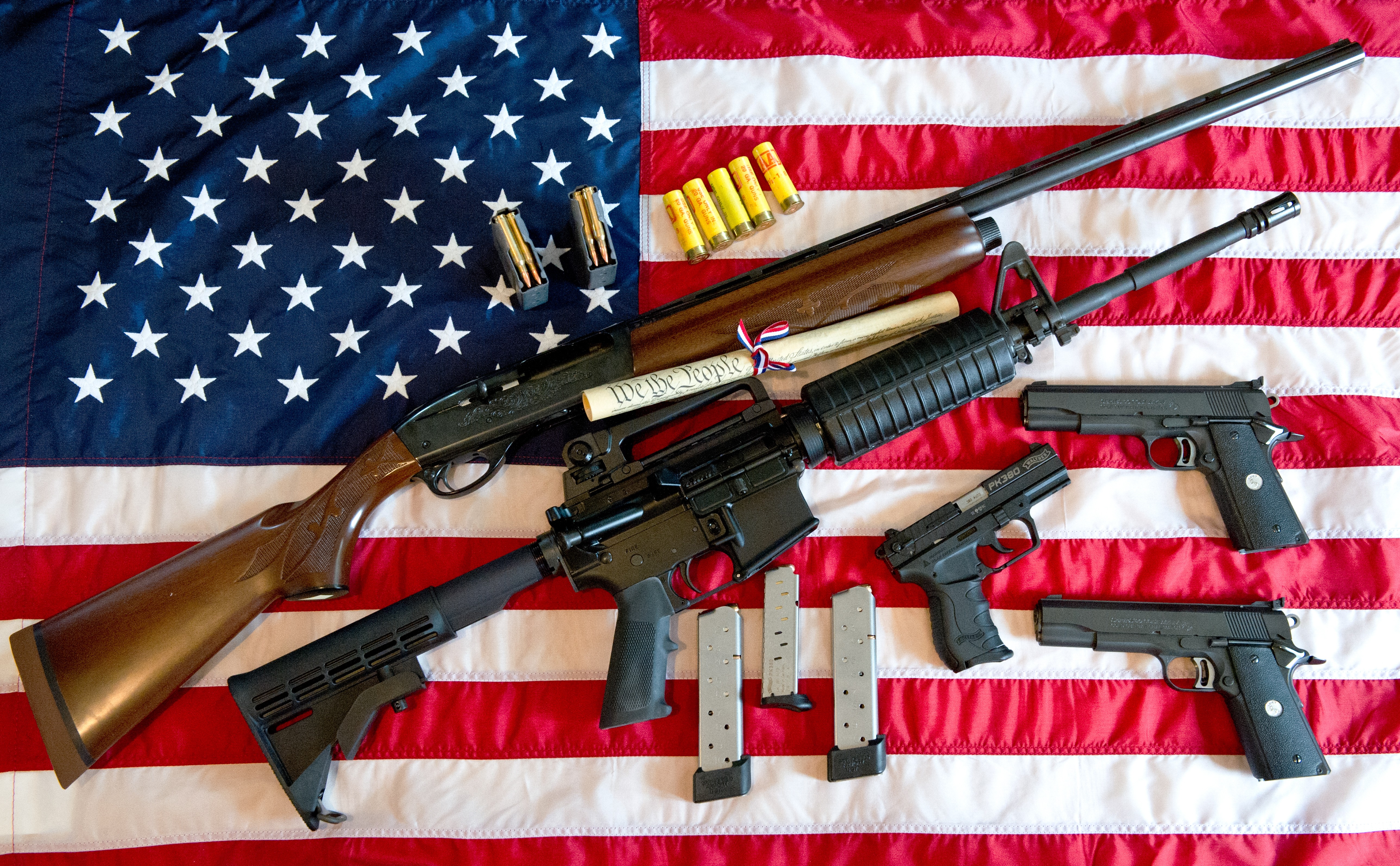 Guns on an American flag.