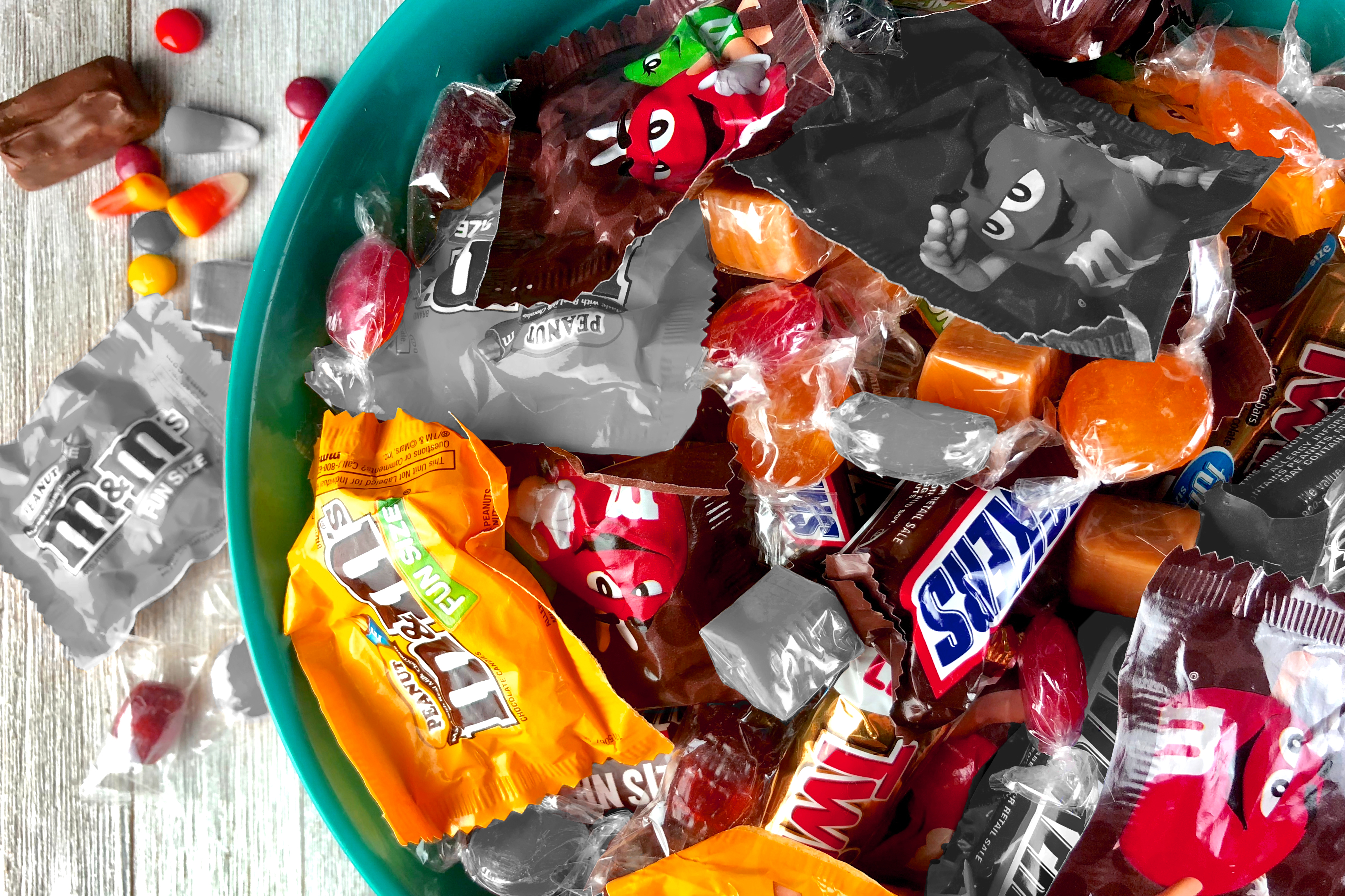 An assortment of fun-sized Halloween candies in a bowl