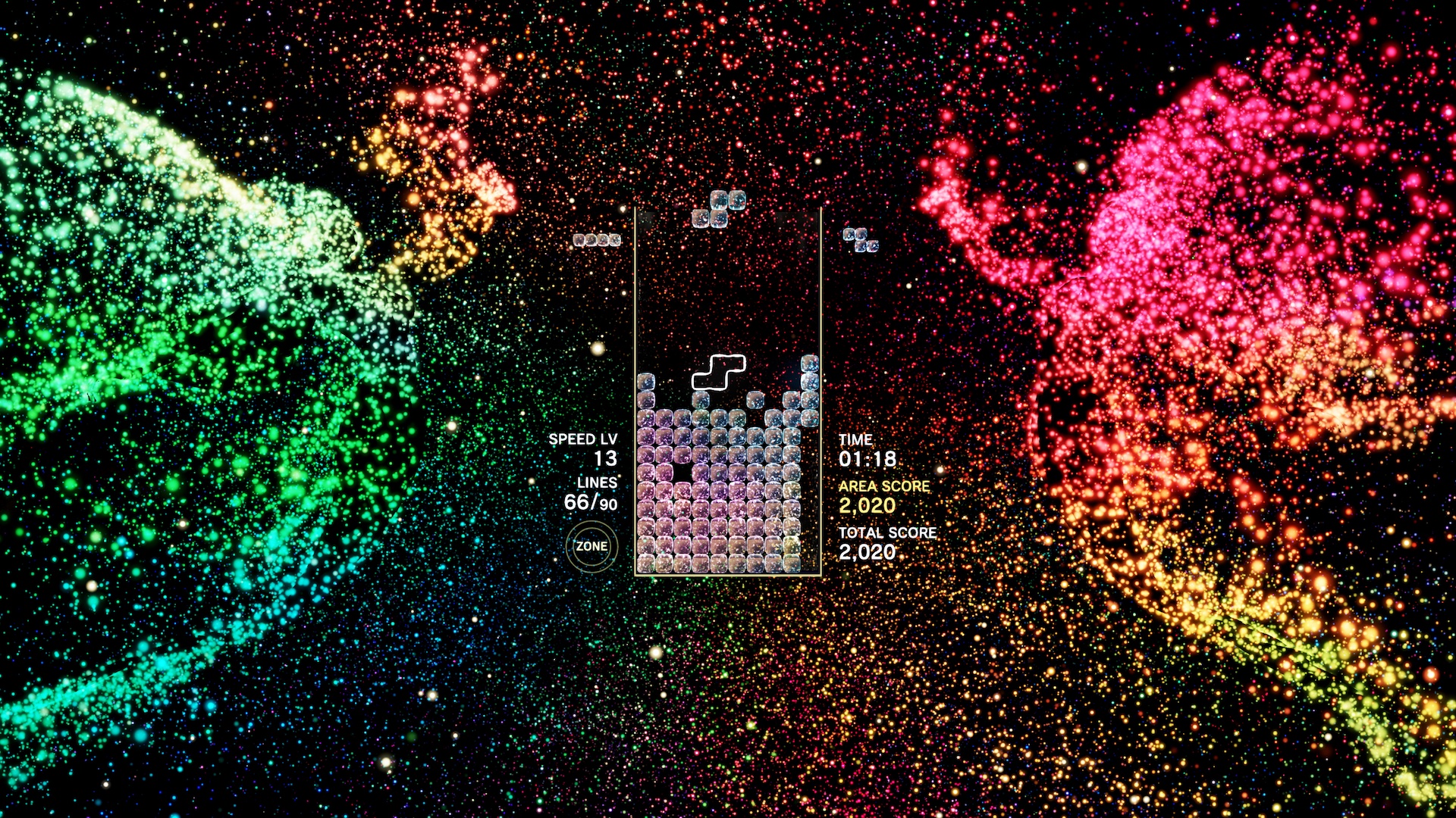 Two particle-based angelic creatures dance on the side of a Tetris Effect level.
