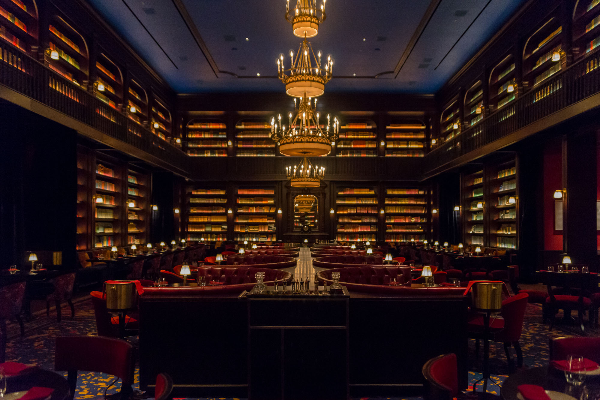 A handsome restaurant with 2,000 books lining the shelves