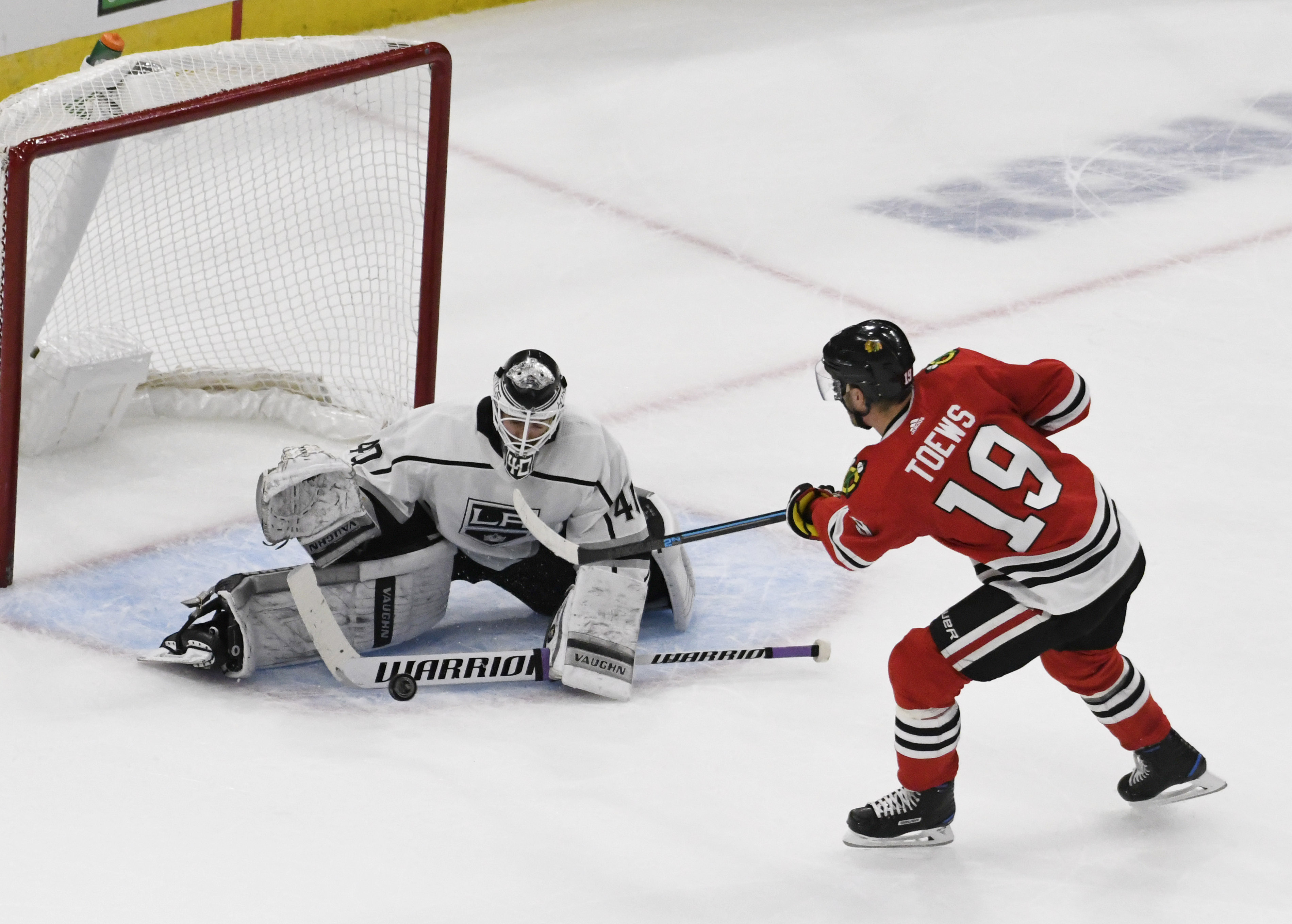 Nov 16, 2018; Chicago, IL, USA; Los Angeles Kings goaltender Calvin Petersen (40) makes a save on Chicago Blackhawks center Jonathan Toews (19) during a shootout at United Center.