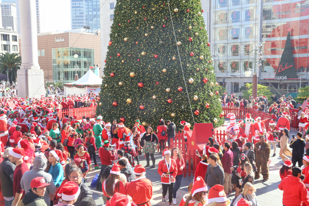 Hundreds of people in Santa suits in Union Square.