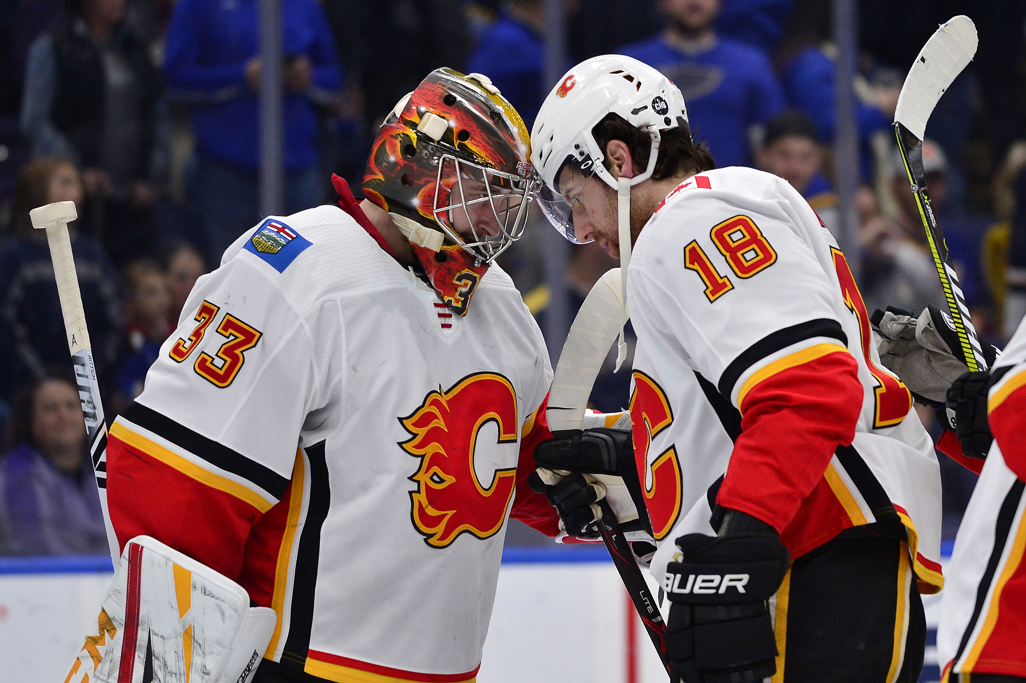 Dec 16, 2018; St. Louis, MO, USA; Calgary Flames goaltender David Rittich (33) celebrates with left wing James Neal (18) after defeating the St. Louis Blues at Enterprise Center