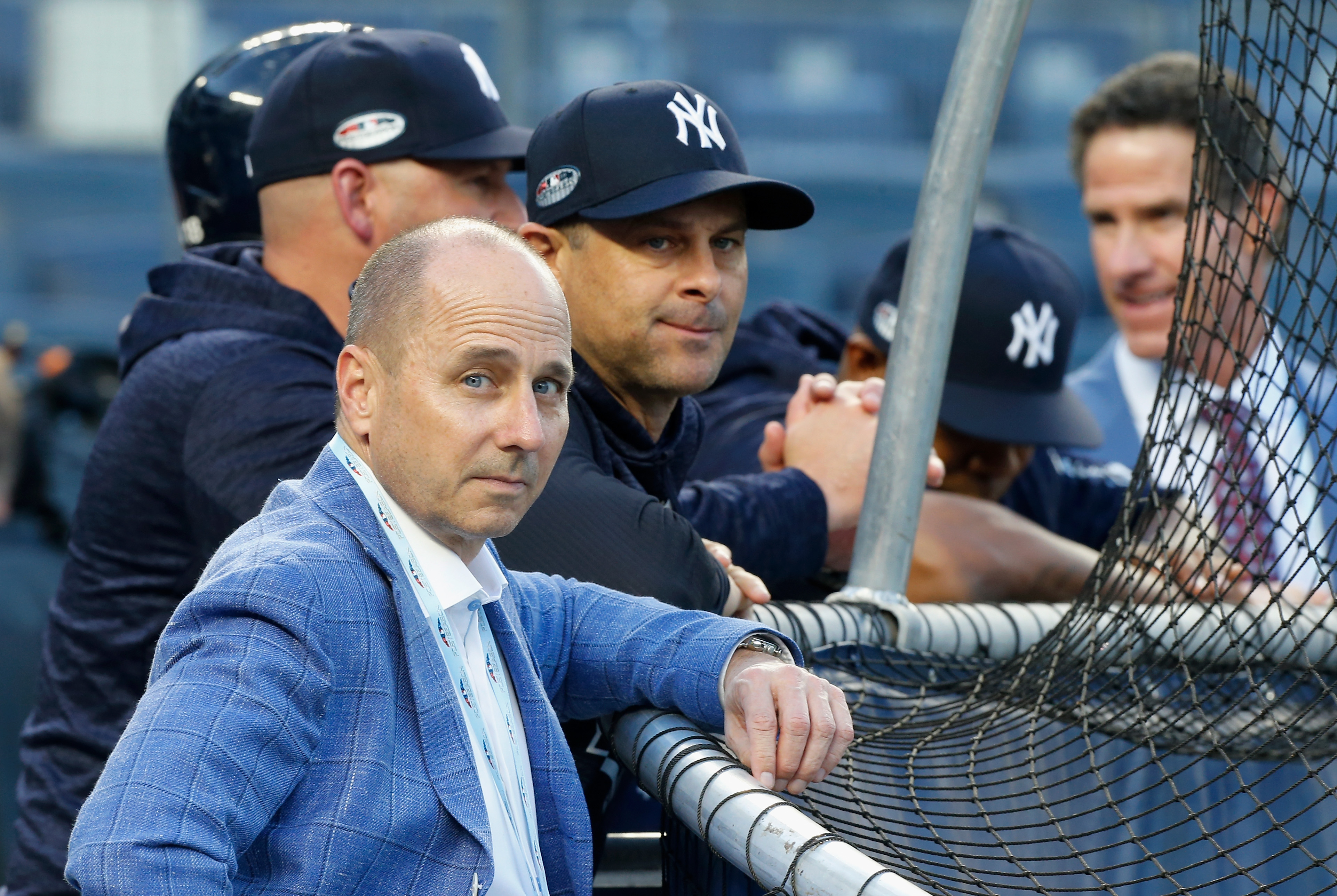 General Manager Brian Cashman and Manager Aaron Boone #17 of the New York Yankees during batting practice before Game Four of the American League Division Series against the Boston Red Sox at Yankee Stadium on October 9, 2018 in the Bronx borough of New Y