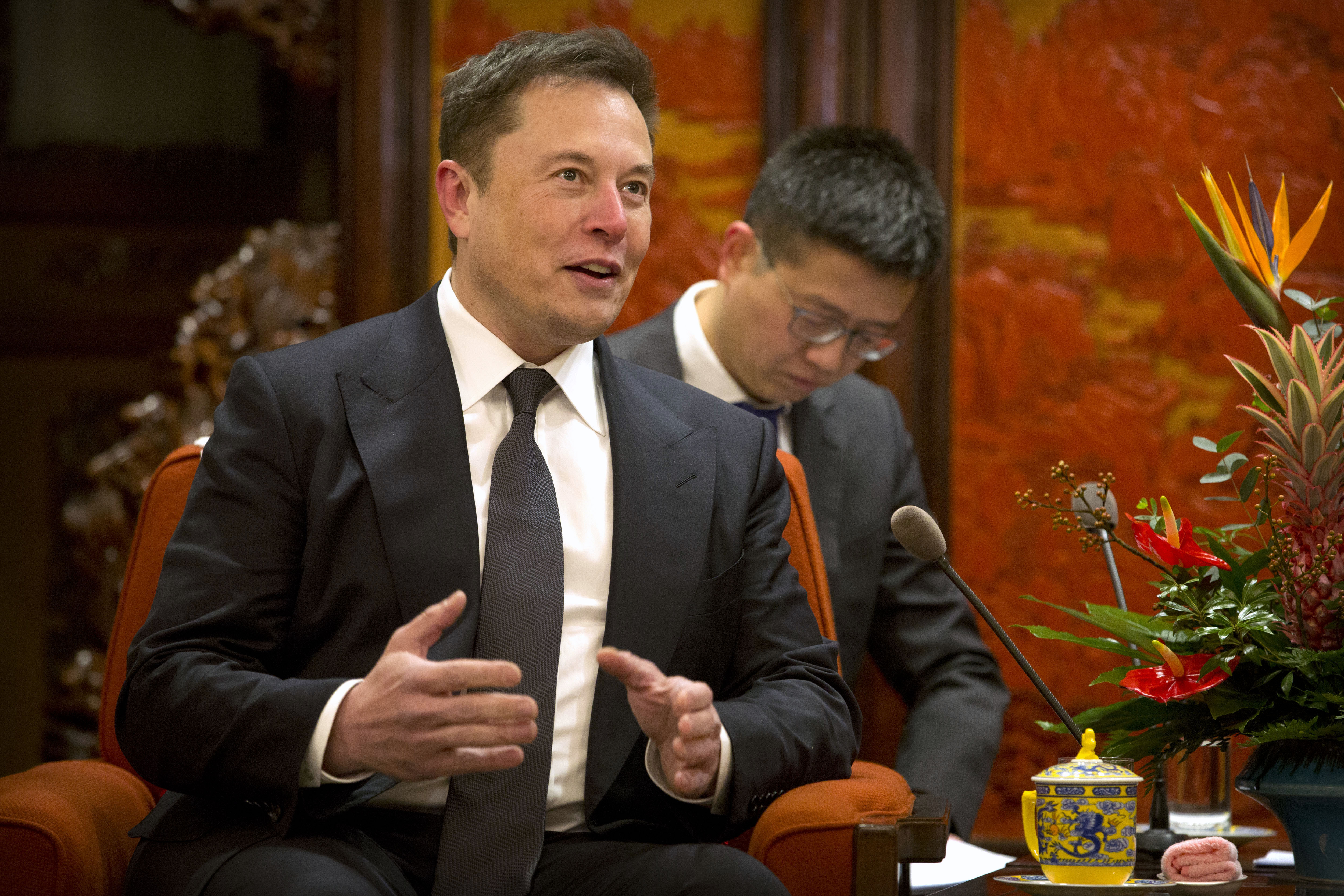Tesla CEO Elon Musk speaks during a meeting with Chinese Premier Li Keqiang.