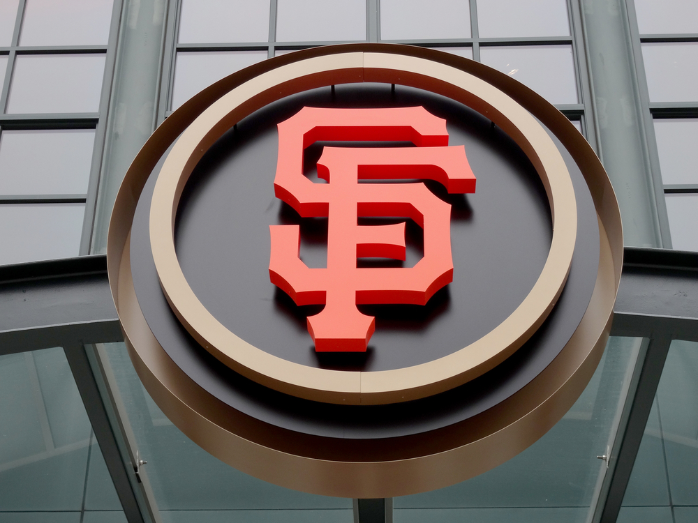 A giant SF Giants logo at the ballpark.