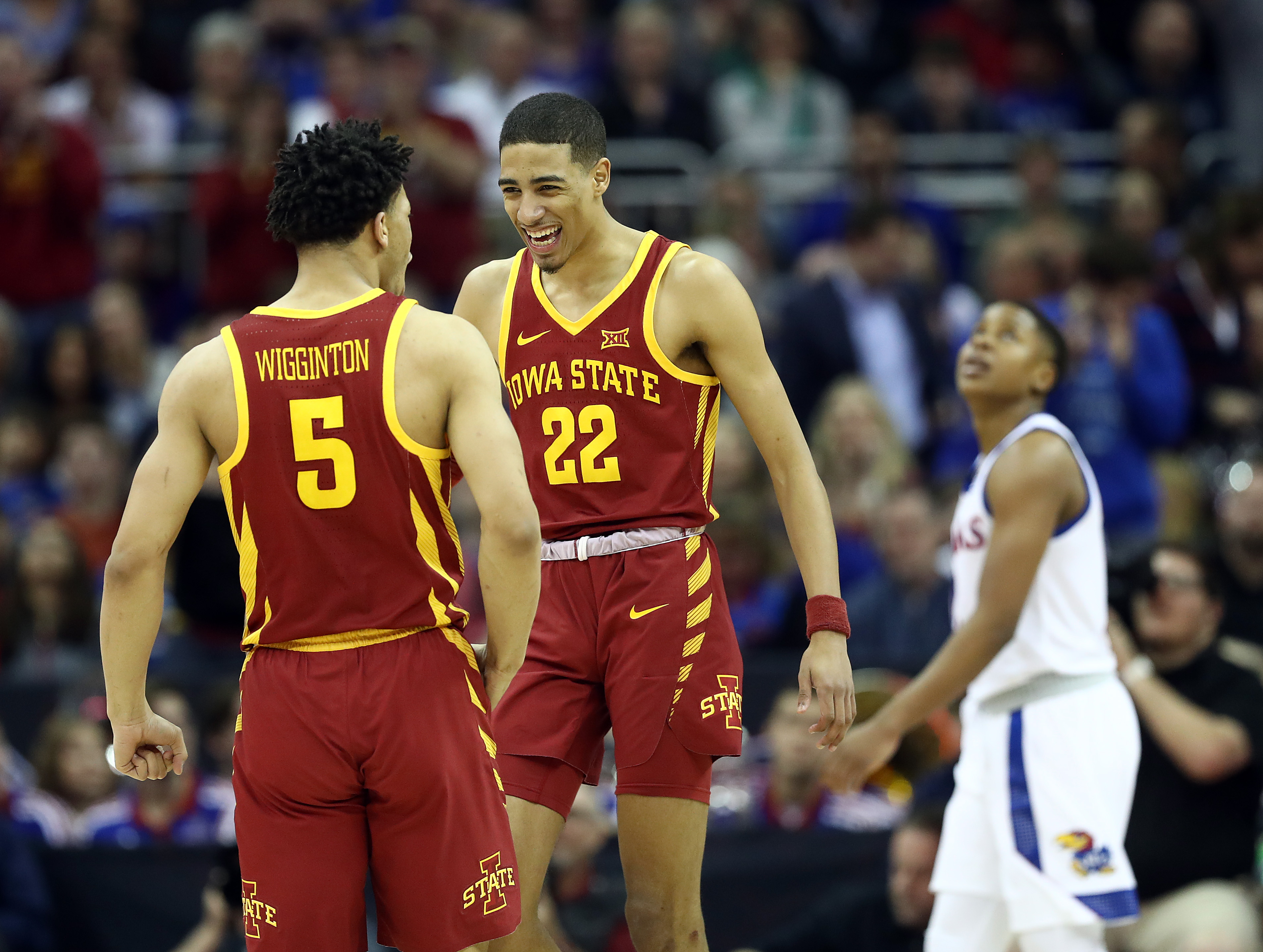 Tyrese Haliburton #22 and Lindell Wigginton #5 of the Iowa State Cyclones celebrate as the Cyclones defeat the Kansas Jayhawks 78-66 to win the Big 12 Basketball Tournament Finals at Sprint Center on March 16, 2019 in Kansas City, Missouri.