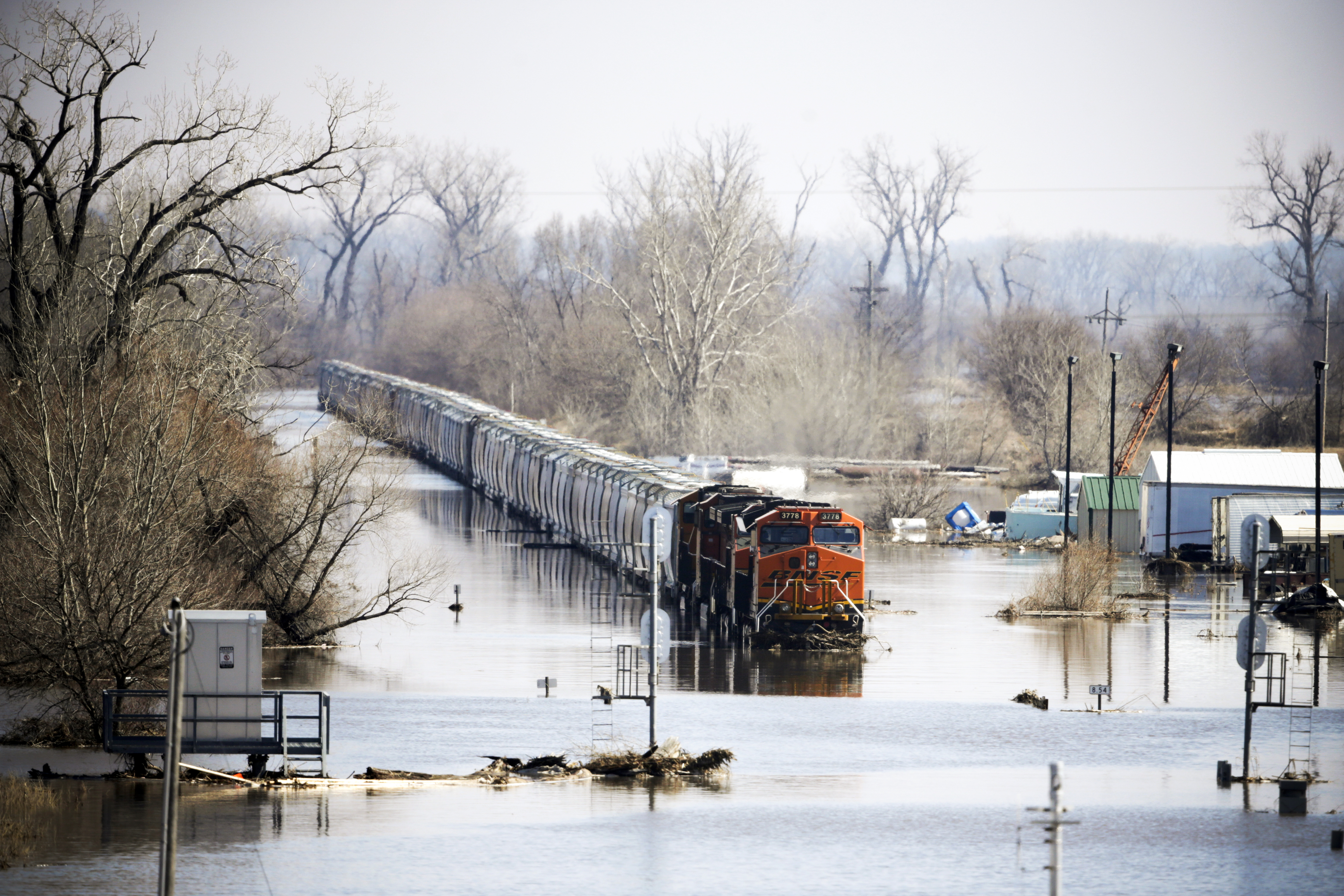 A freight train sits idle in flood waters from the Platte River, in Plattsmouth, Nebraska on March 17, 2019.