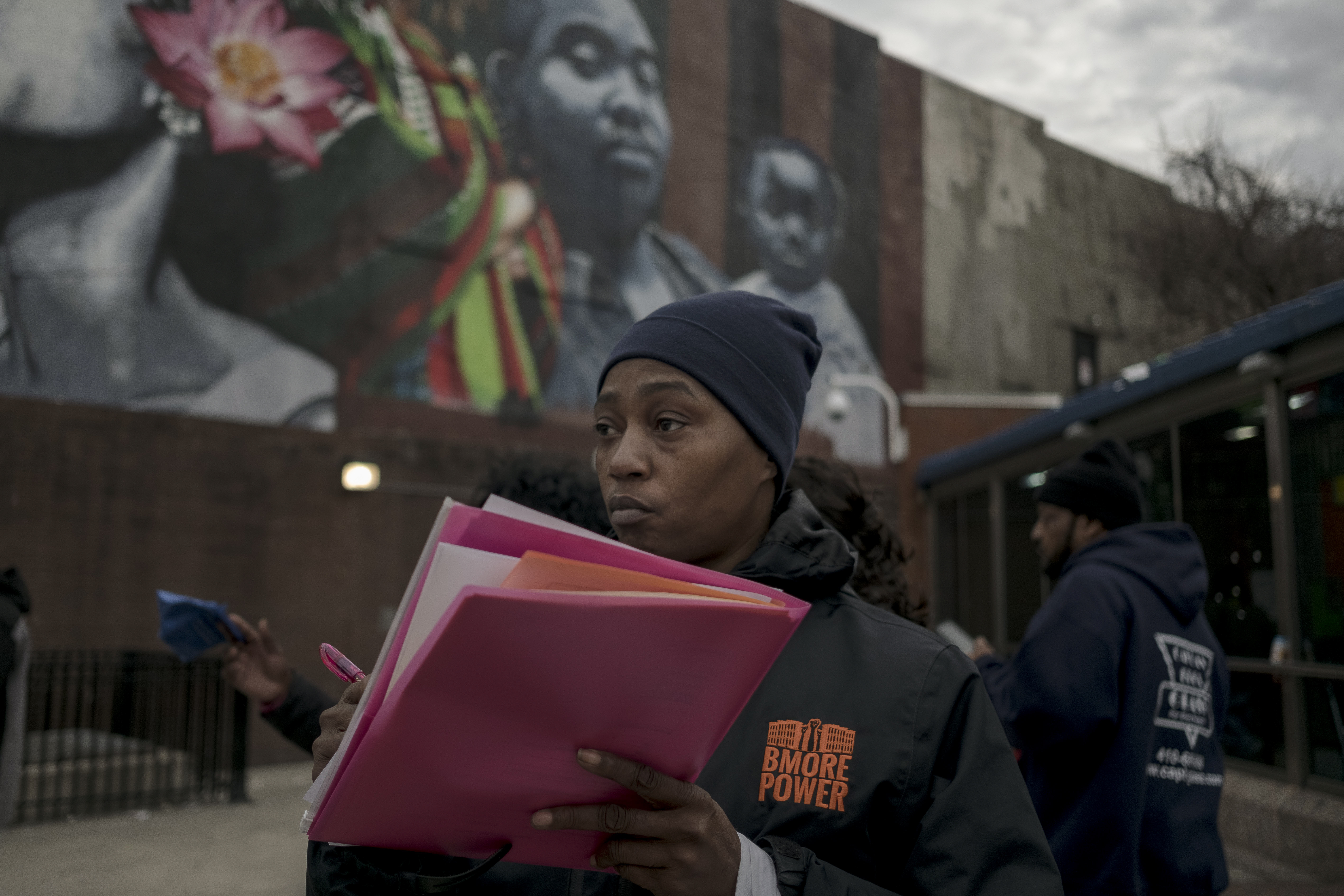 Raichelle “Ro” Johnson with Bmore POWER hands out the opioid overdose antidote naloxone and fentanyl testing strips in West Baltimore, Maryland, on March 13, 2019. Baltimore has seen a dramatic increase in drug overdose deaths in recent years.