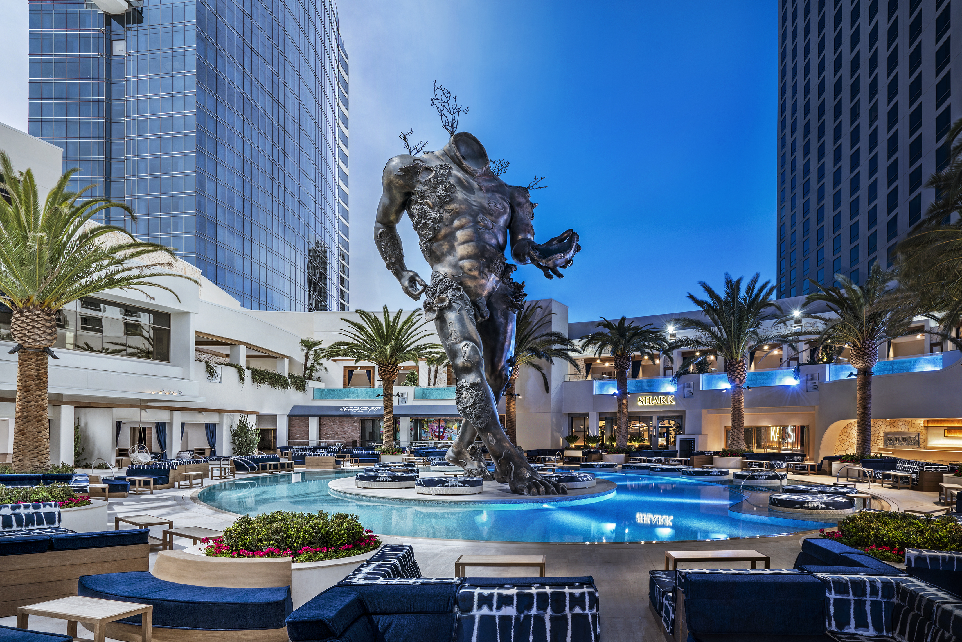 Damien Hirst’s “Demon with Bowl” anchors the new Kaos pool club at the Palms.