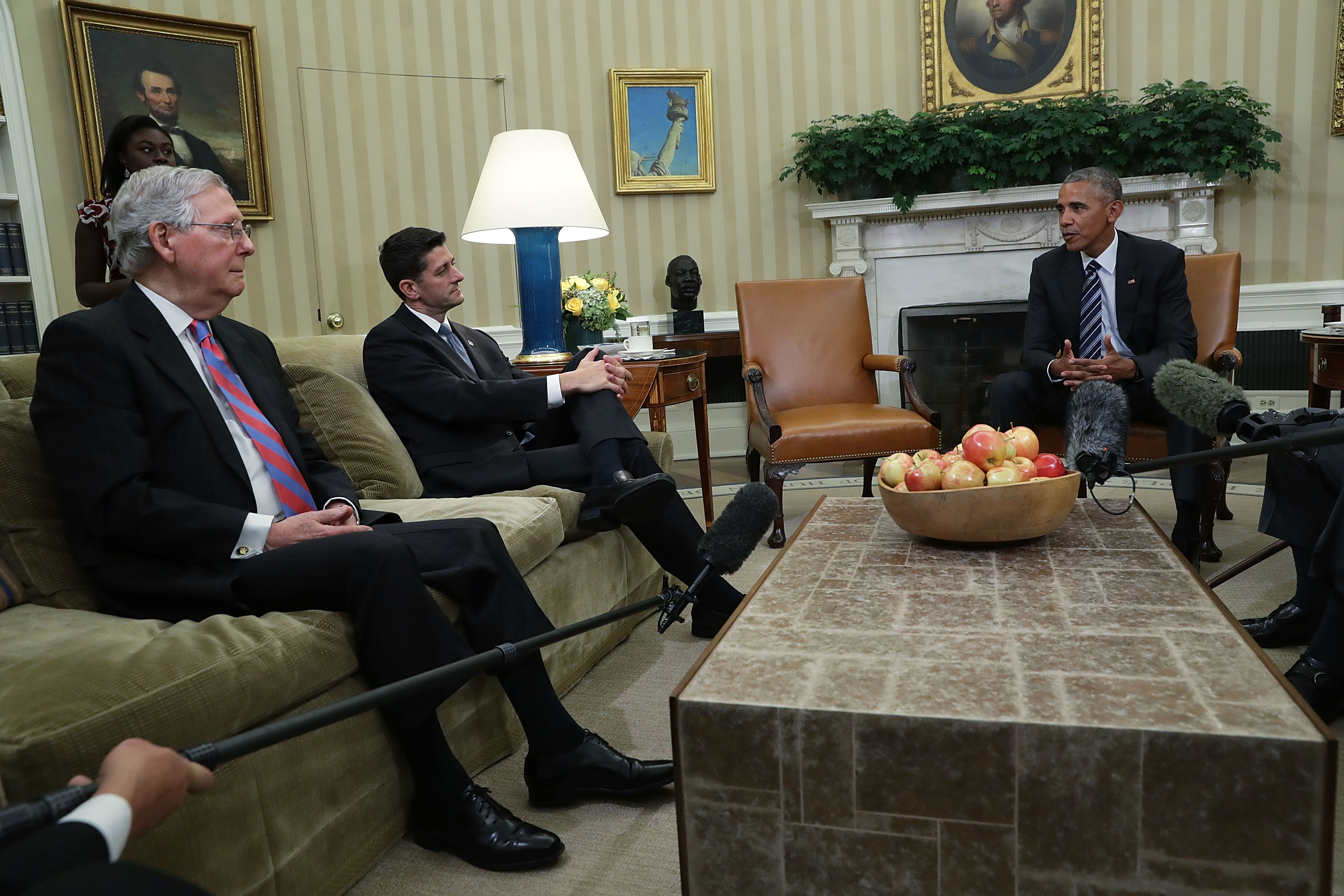 Sen. Mitch McConnell (R-KY), left, and Rep. Paul Ryan (R-WI) listen to President Barack Obama during an Oval Office meeting at the White House&nbsp;in 2016.