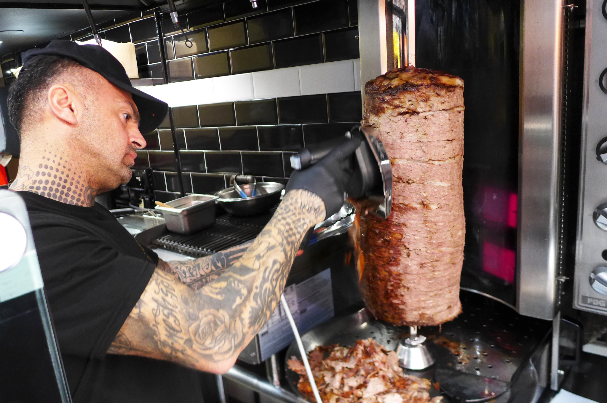 Slicing the Turkish doner kebab at Berlin Doner