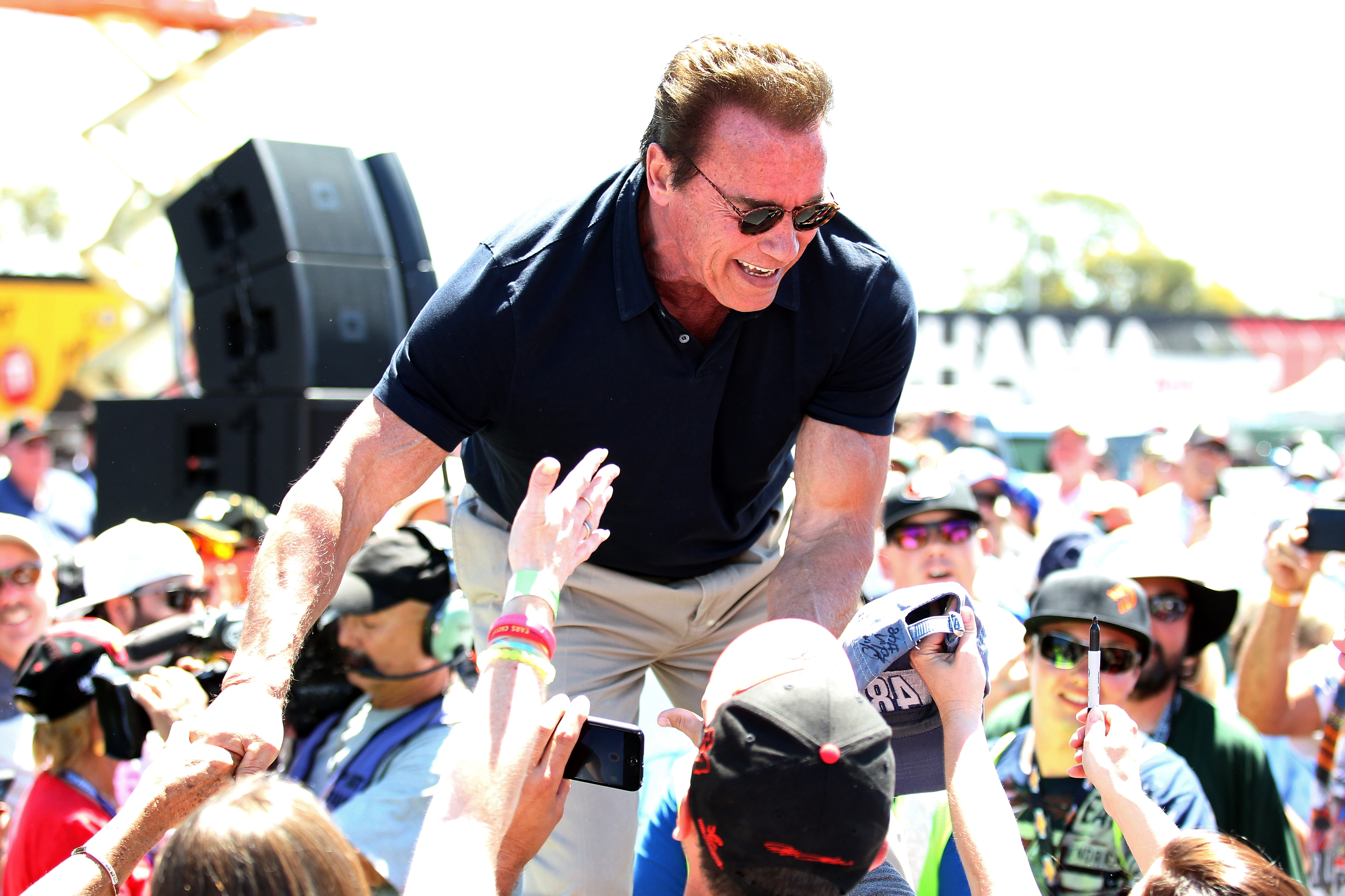 Actor and former governor of California Arnold Schwarzenegger greets fans at a NASCAR event on June 28, 2015, in Sonoma, California.