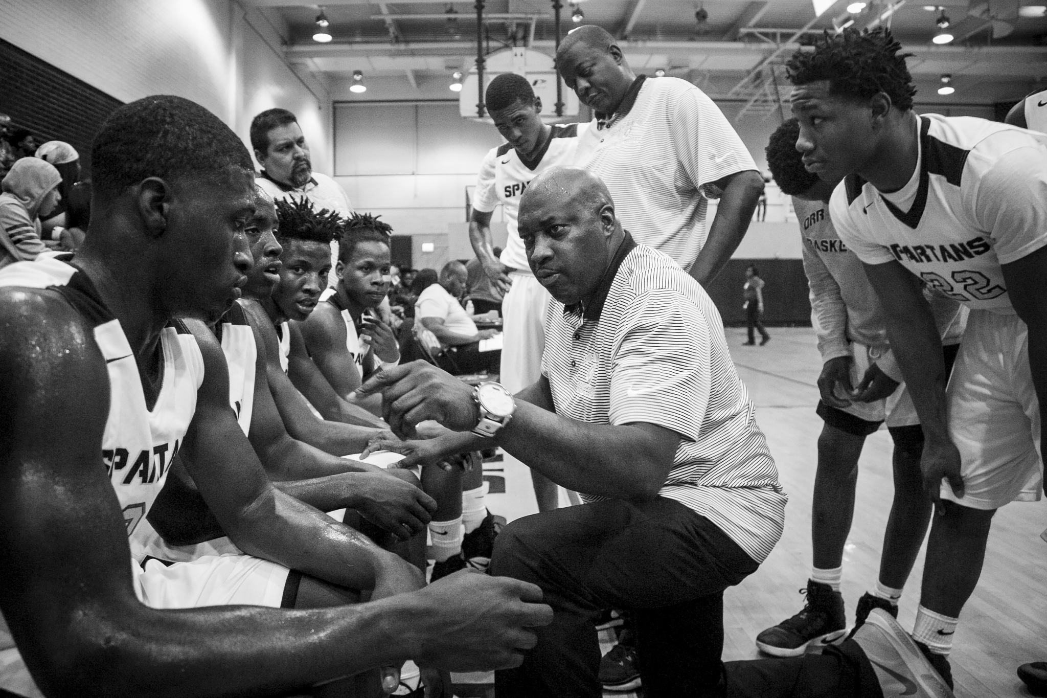 Coach Lou Adams talks to his players during a timeout against North Lawndale College Prep High School at Orr Academy High School, Jan. 13, 2017.