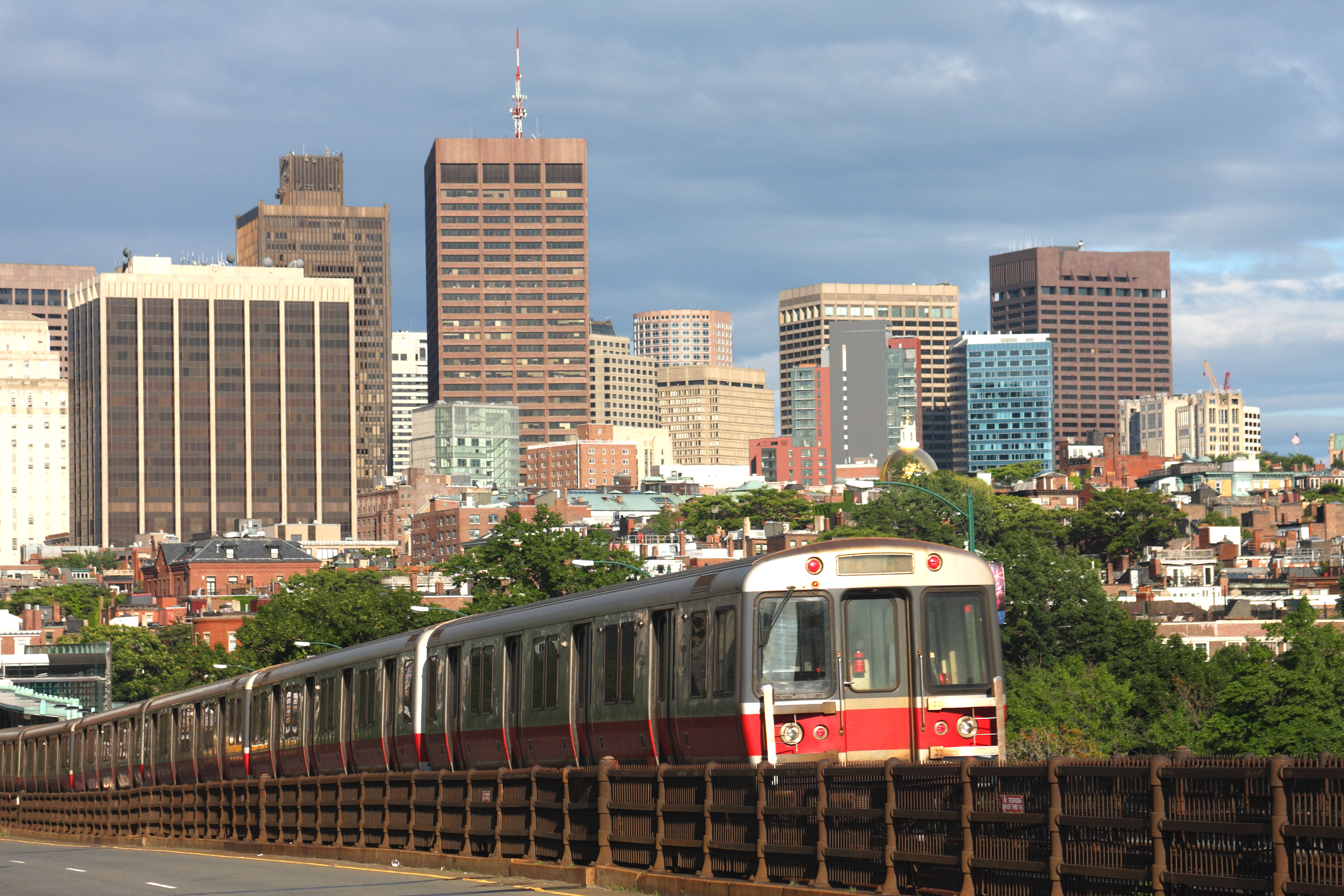 train against Boston skyline