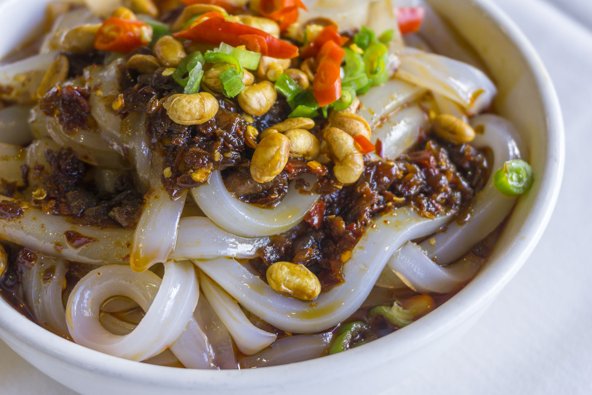 A closeup view of Chengdu Taste’s mung bean jelly noodles with chili sauce.