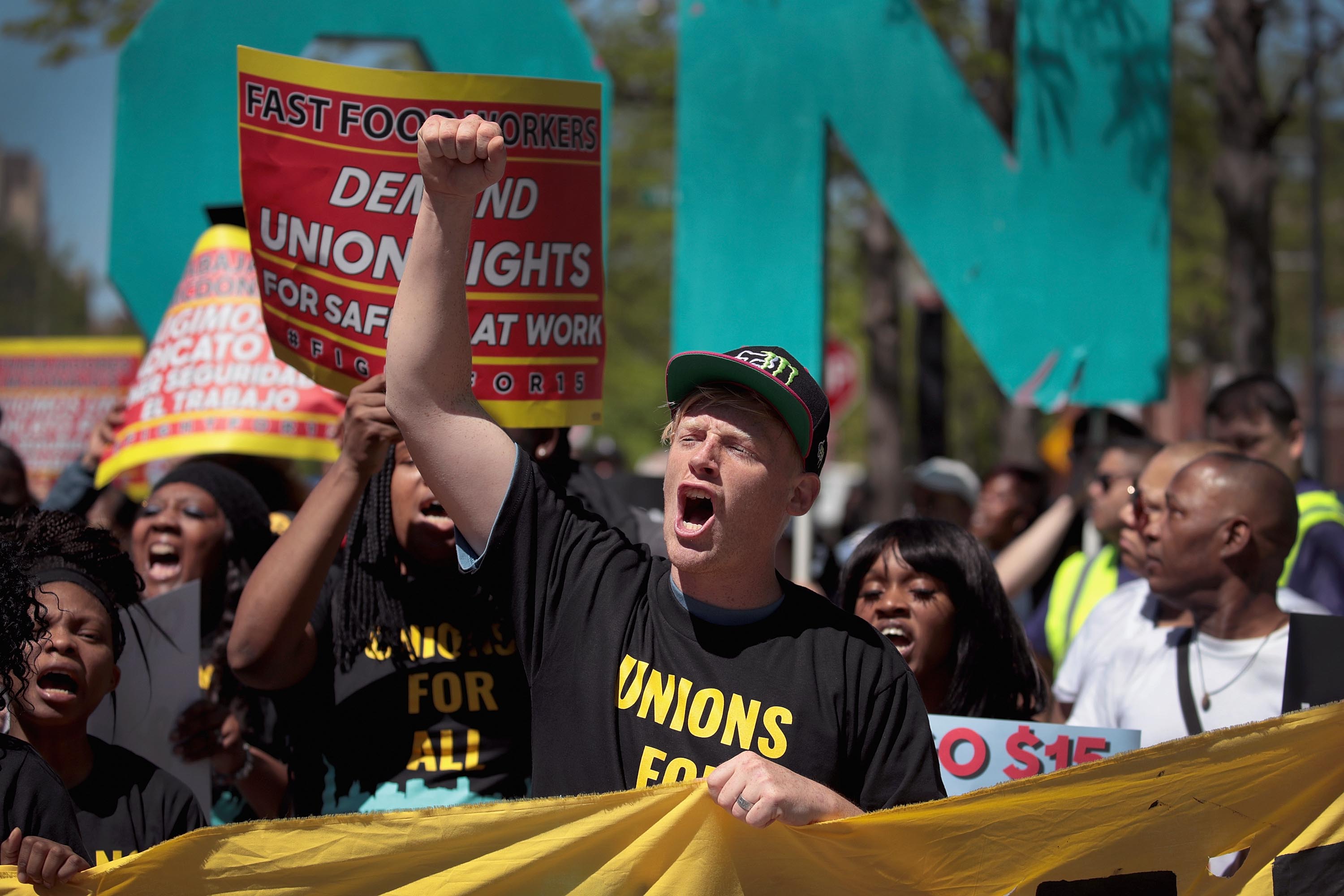 Demonstrators, who were joined by Democratic presidential candidate and Washington governor Jay Inslee, march to McDonald’s corporate headquarters to demand $15-per-hour wages for fast food workers on May 23, 2019 in Chicago, Illinois. Inslee is one of mo