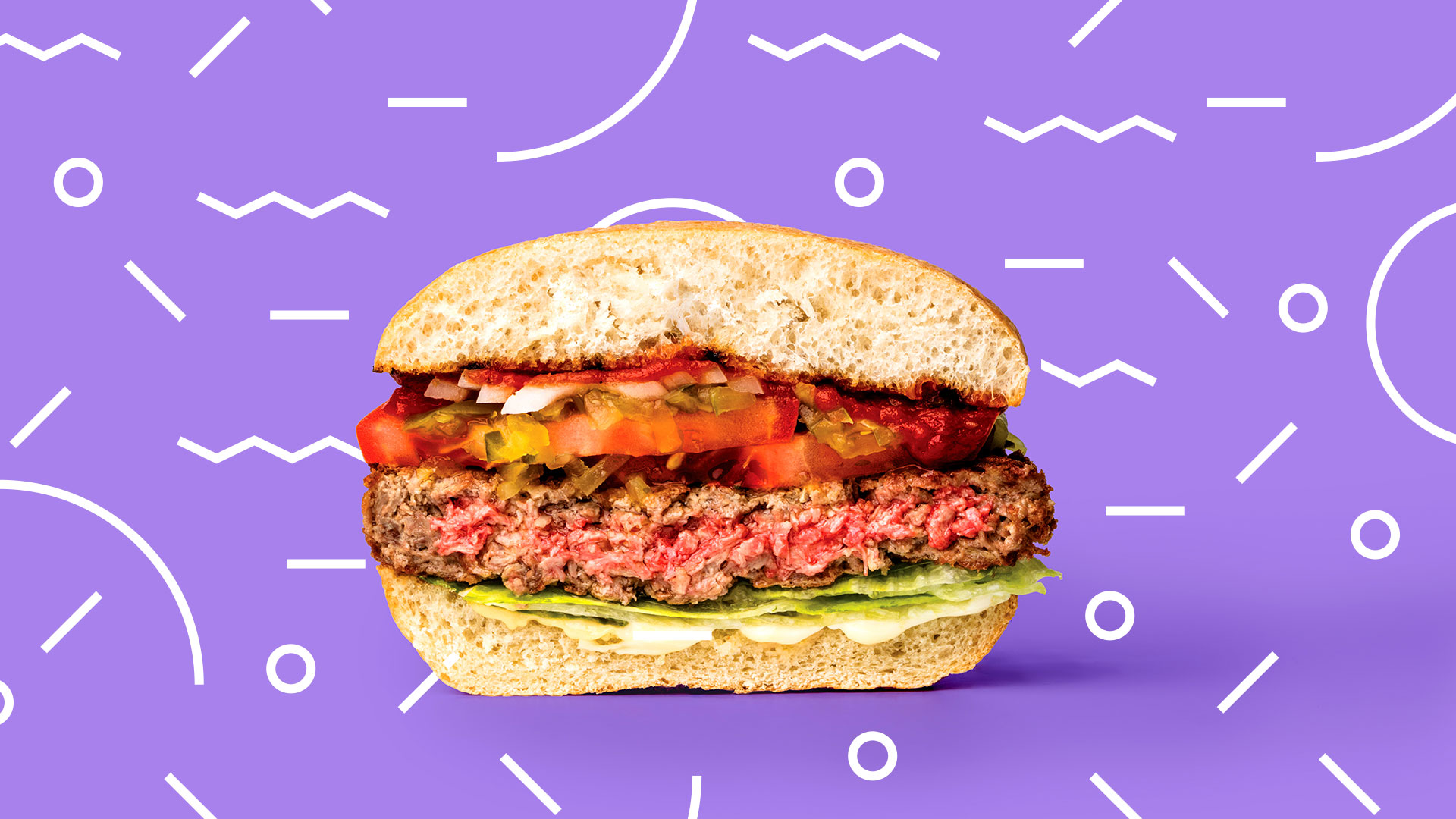 A cross section of an Impossible Burger against a jazzy purple background.