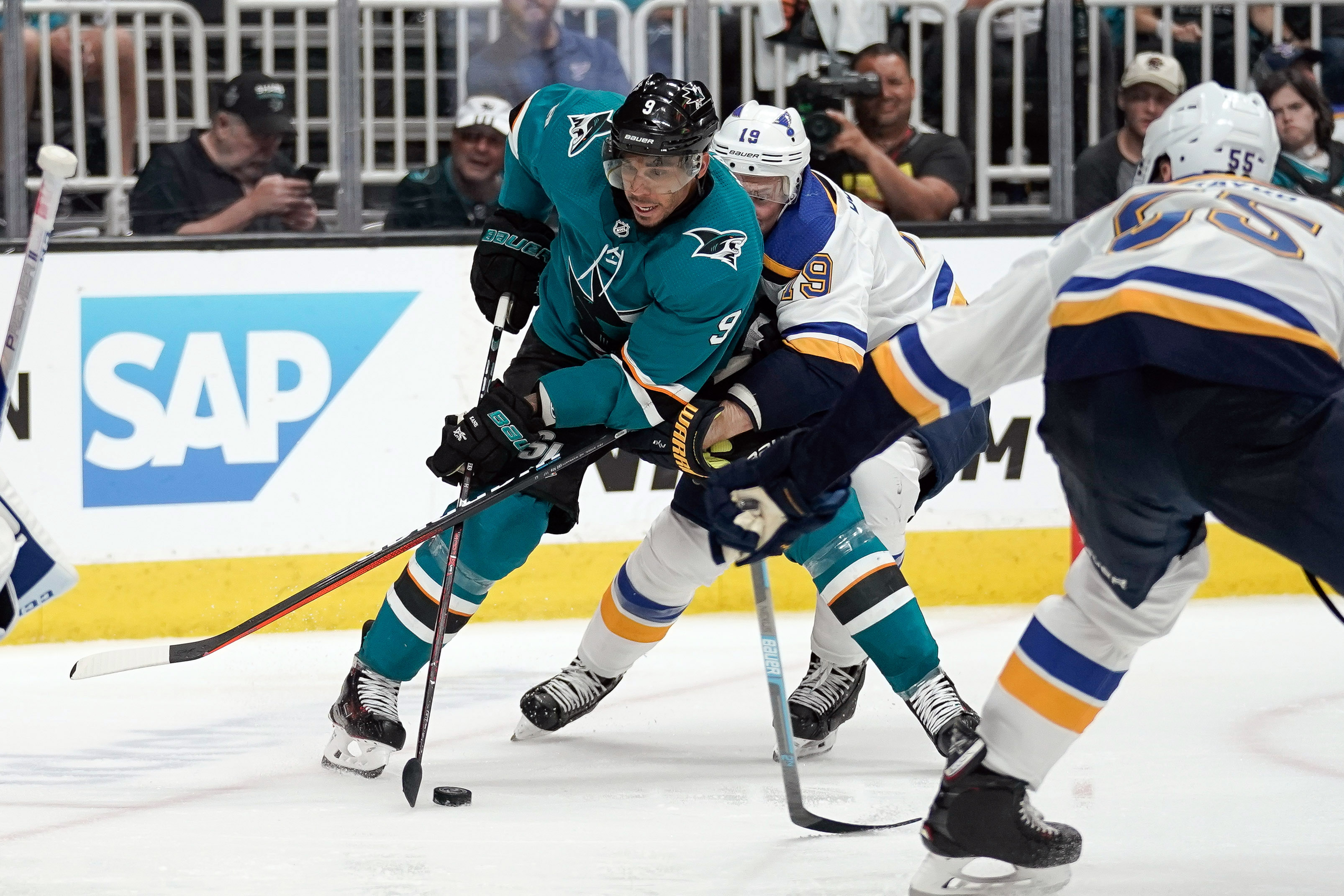 May 11, 2019; San Jose Sharks left wing Evander Kane controls the puck against St. Louis Blues defenseman Jay Bouwmeester and defenseman Colton Parayko during the third period in game one of the Western Conference Final of the 2019 Stanley Cup Playoffs at