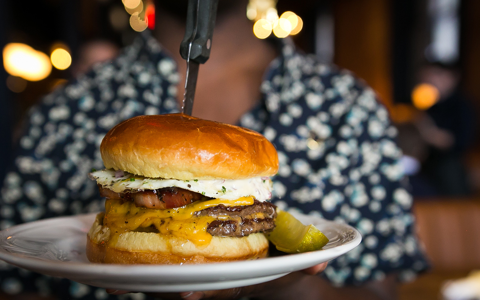 The Au Cheval burger with a fried egg and thick slab bacon