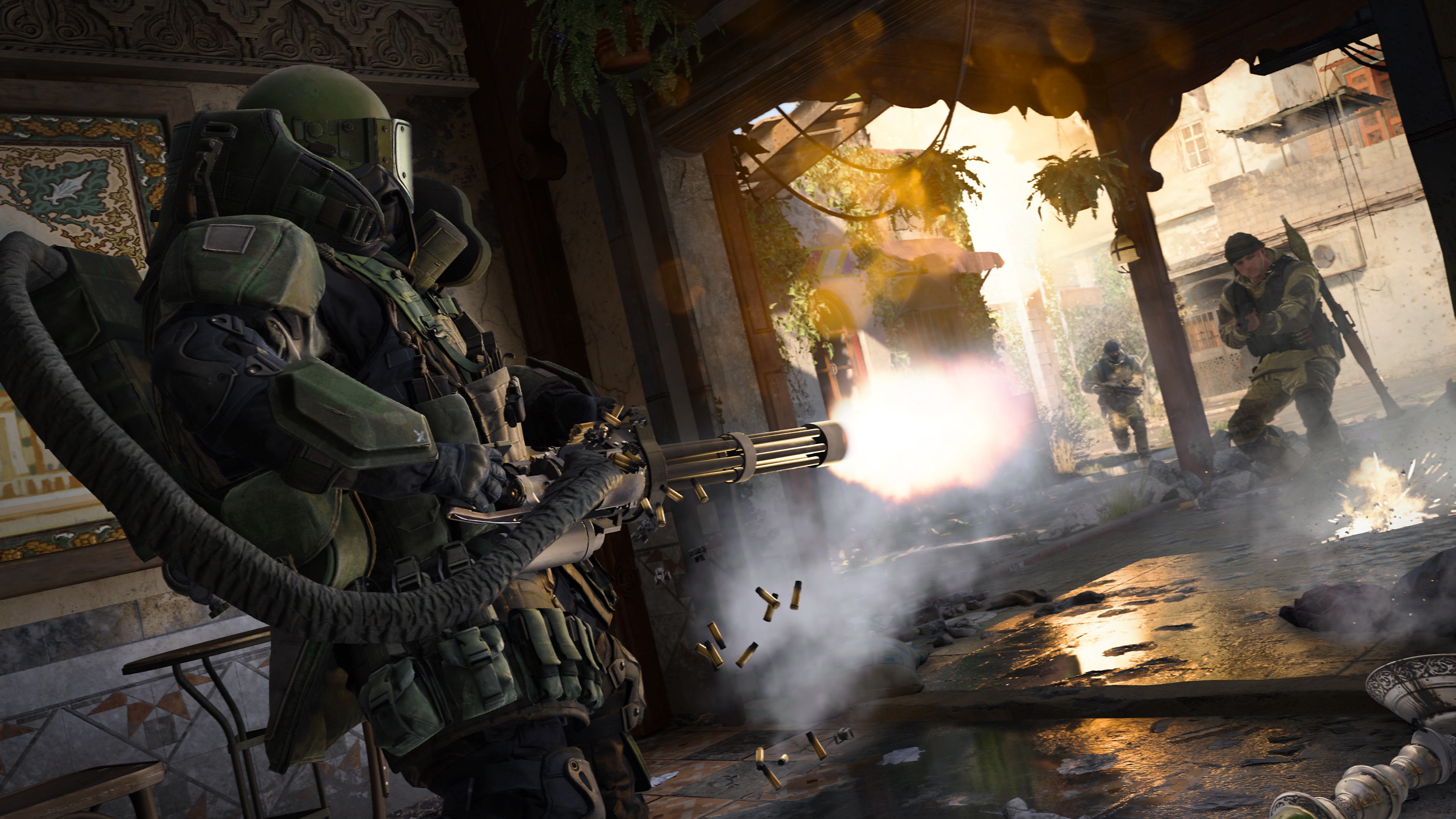 A player wearing heavy Juggernaut armor aims a minigun at another player in a bombed-out cafe in a screenshot from Call of Duty: Modern Warfare (2019)