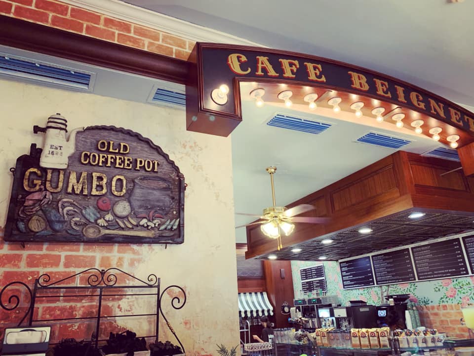 The Old Coffee Pot sign is next to a Cafe Beignet banner at the new incarnation of the 125-year old restaurant