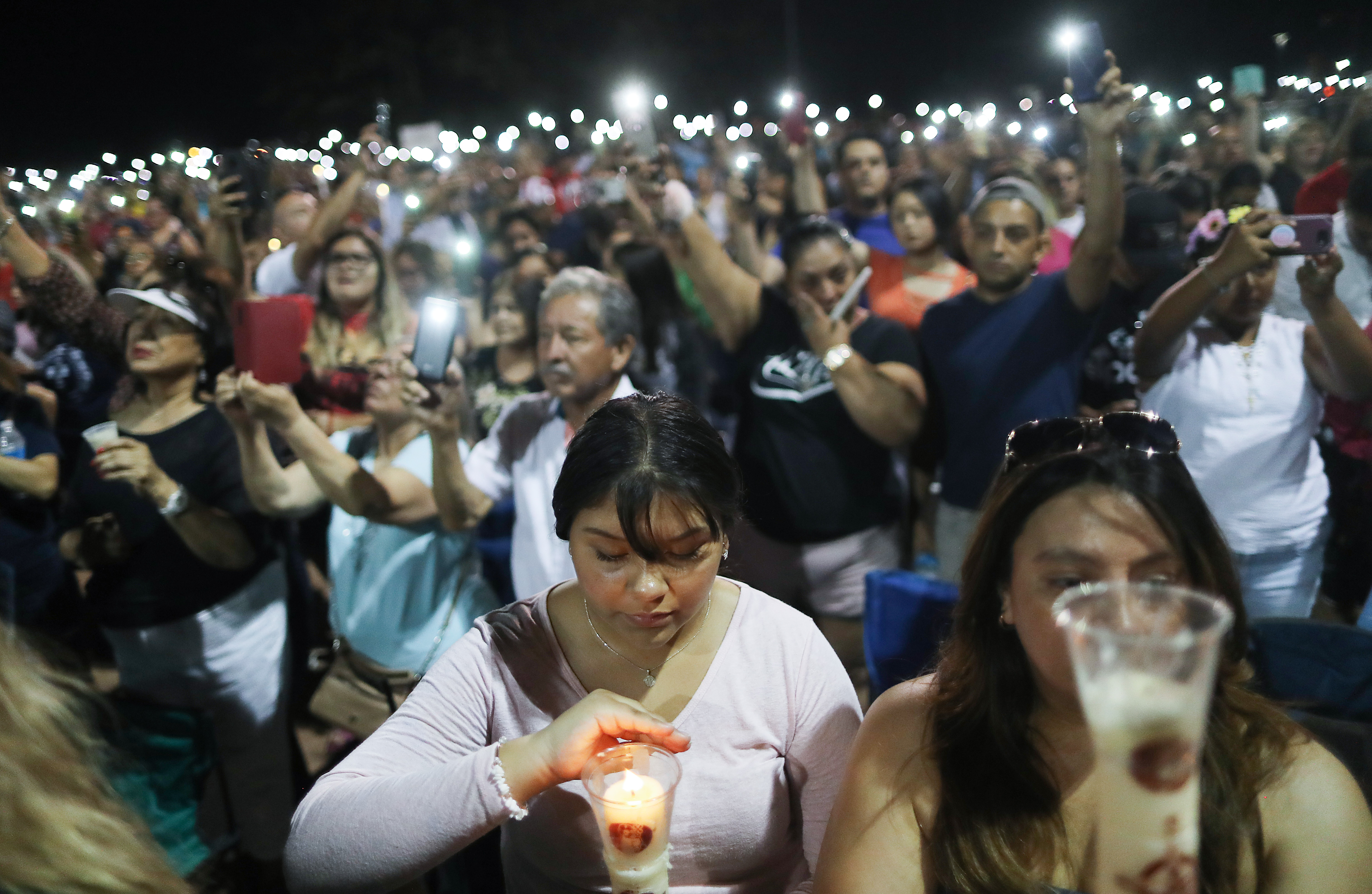 A large group of El Paso residents gather for a candlelight vigil.