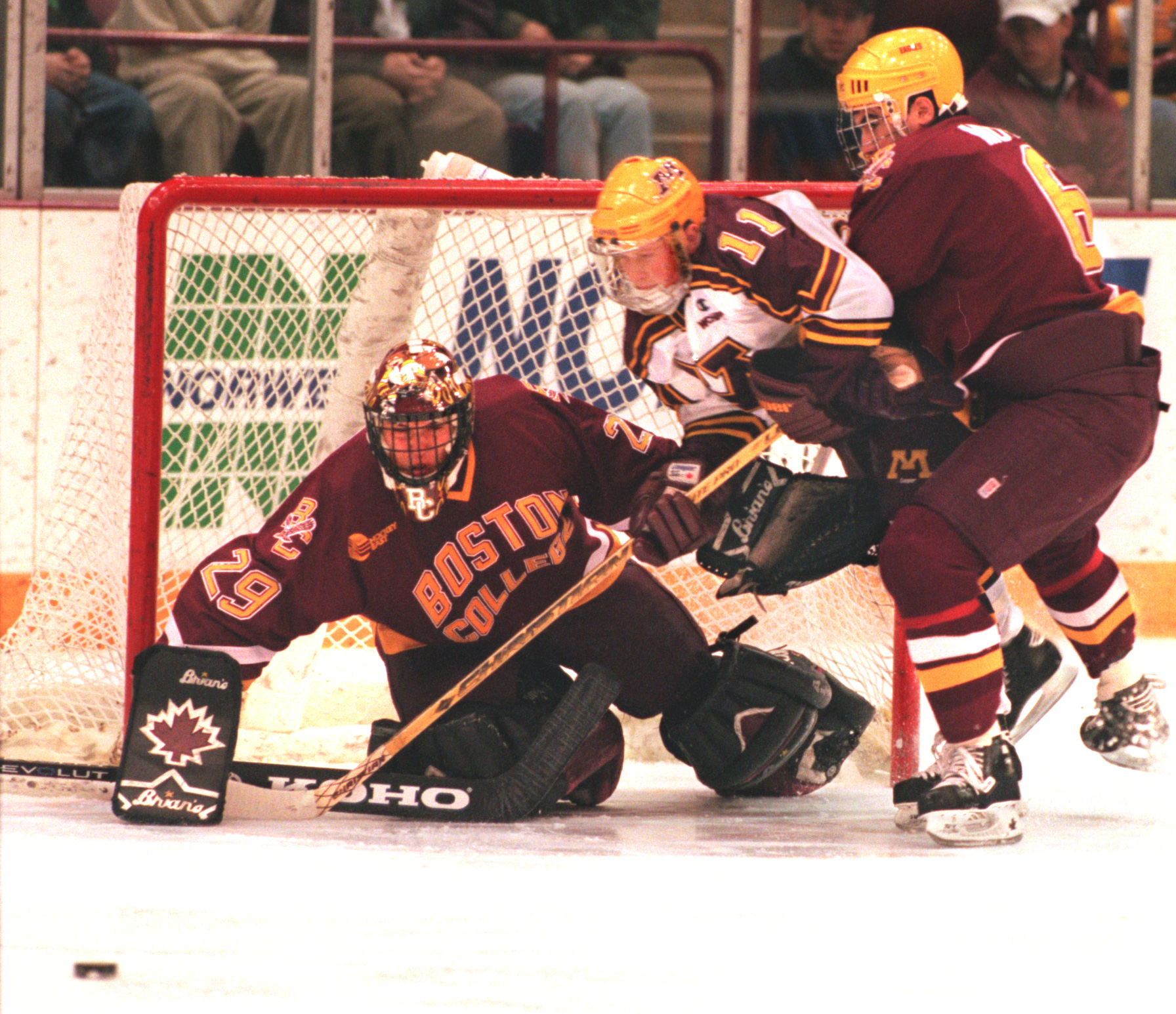 The Gopher’s Dave Spehar gets the squeeze put on him by Boston College’s goalie Greg Taylor and Mike Mottau as Spehar attempts to ge to the puck ist period action at Marriuci.(Photo by MARLIN LEVISON/Star Tribune via Getty Images)