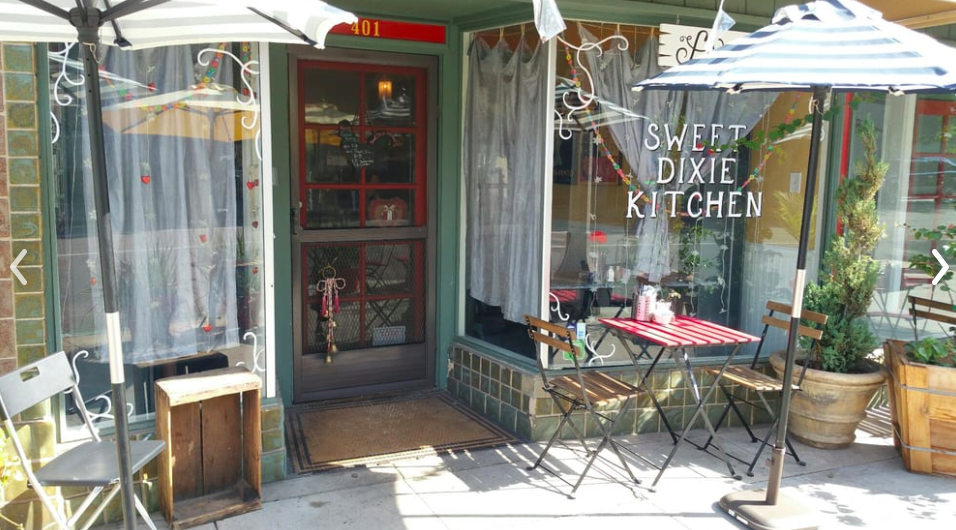 Sweet Dixie Kitchen’s restaurant exterior, with tables, in Long Beach.