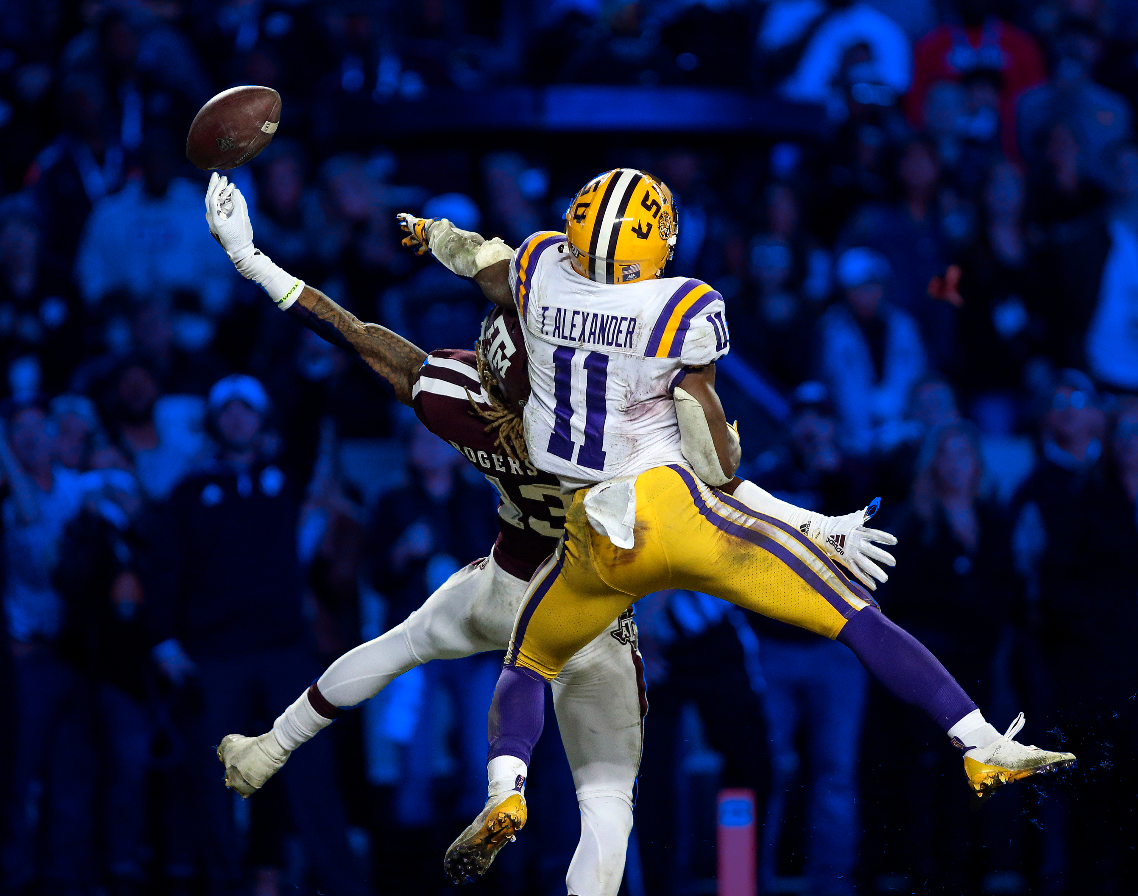 LSU and Texas A&amp;M played six overtimes in 2018. Here, a Tiger and an Aggie contest a pass.
