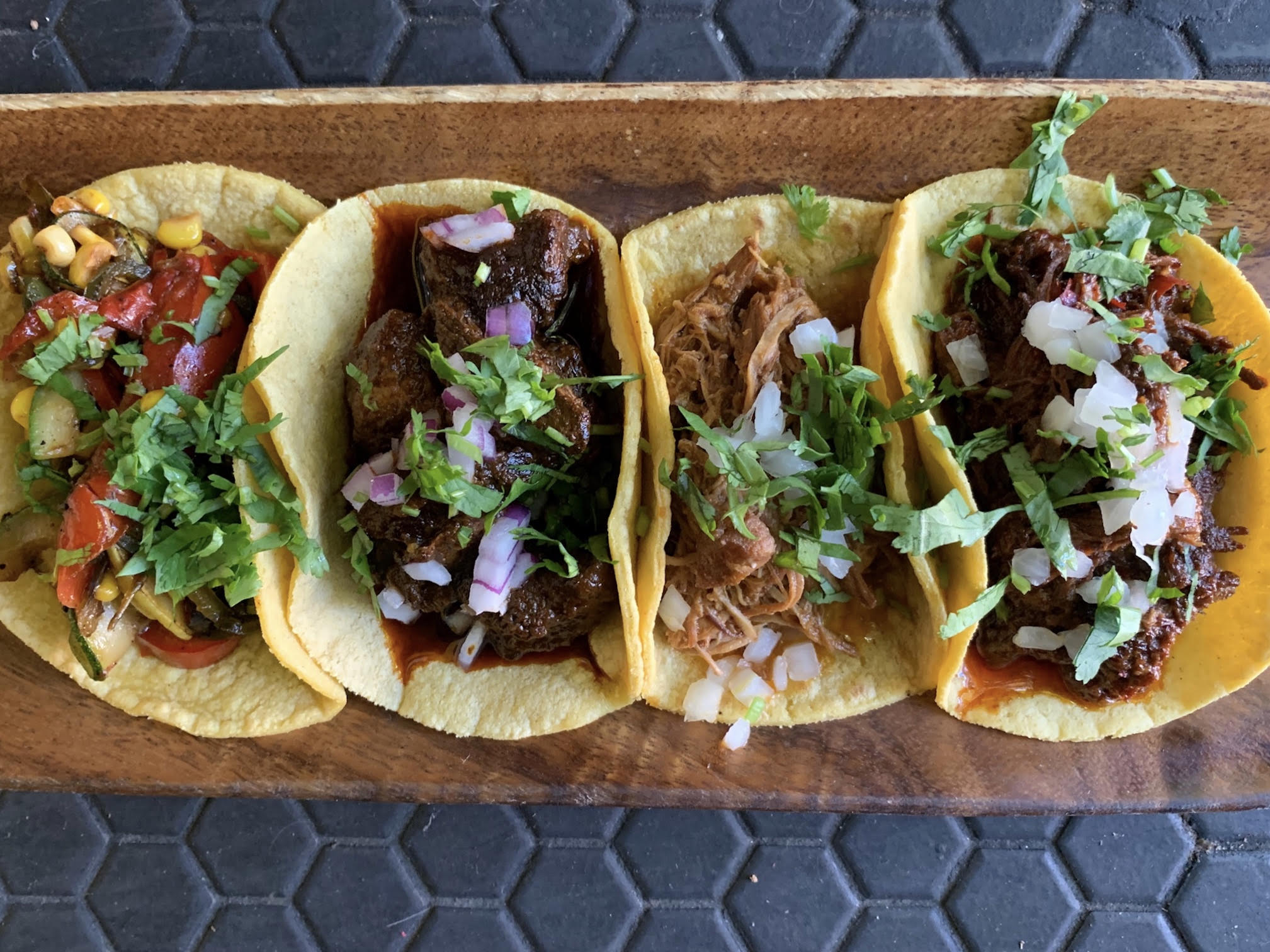 Four tacos de guisado at Tacoliciious