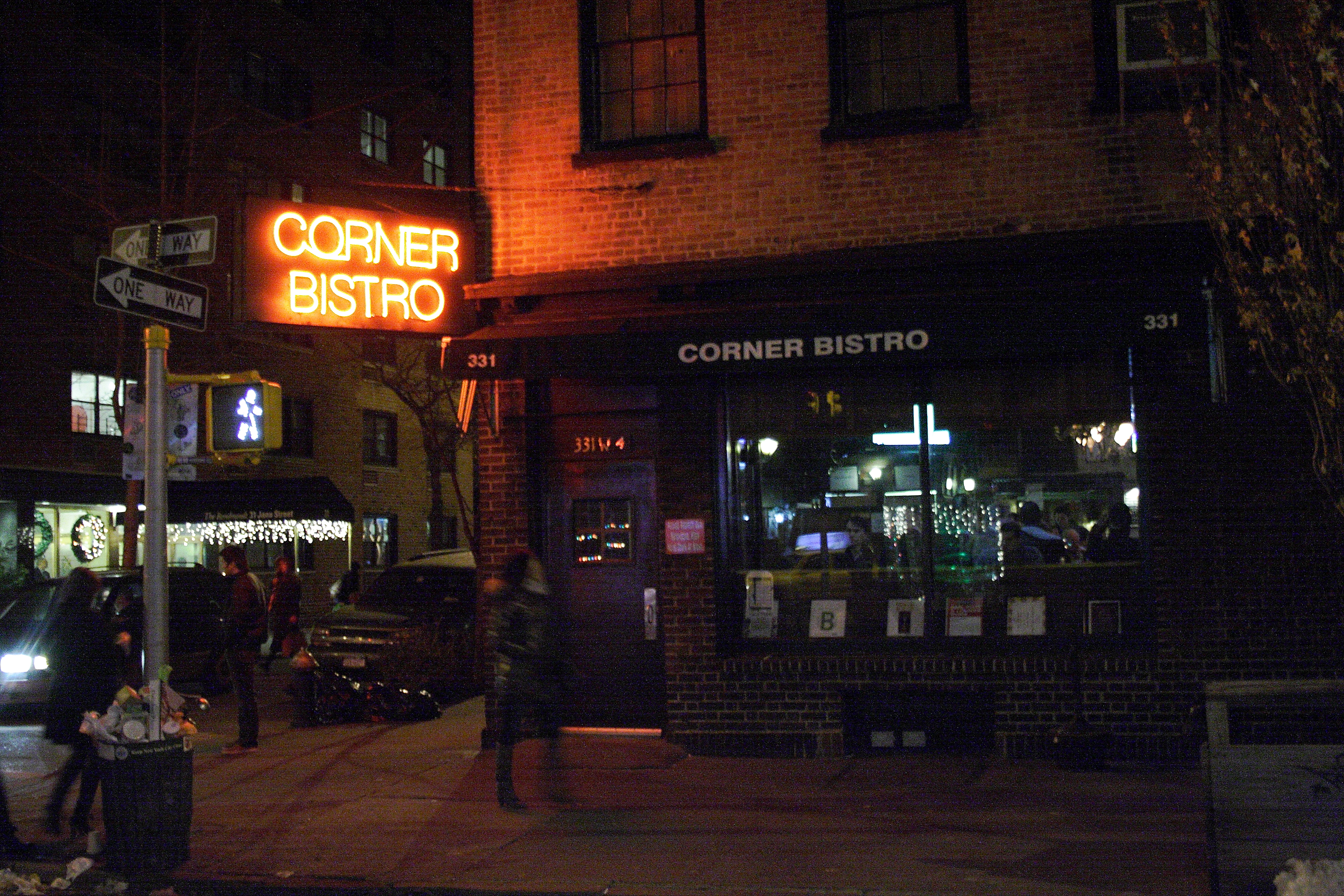 A neon sign harkens the entrance to Corner Bistro