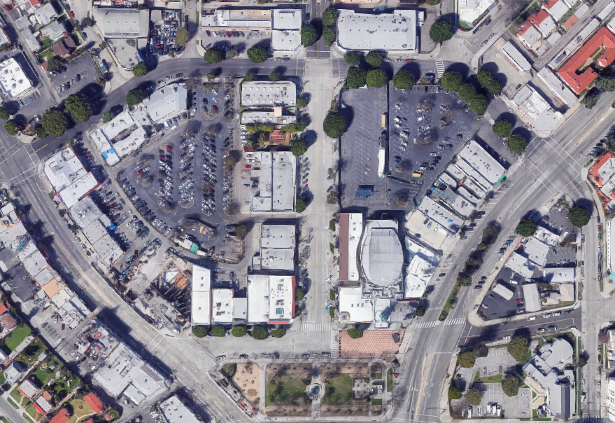 An aerial photo showing Leimert Park Village, a largely commercial area of lower-rise buildings bisected by major streets.