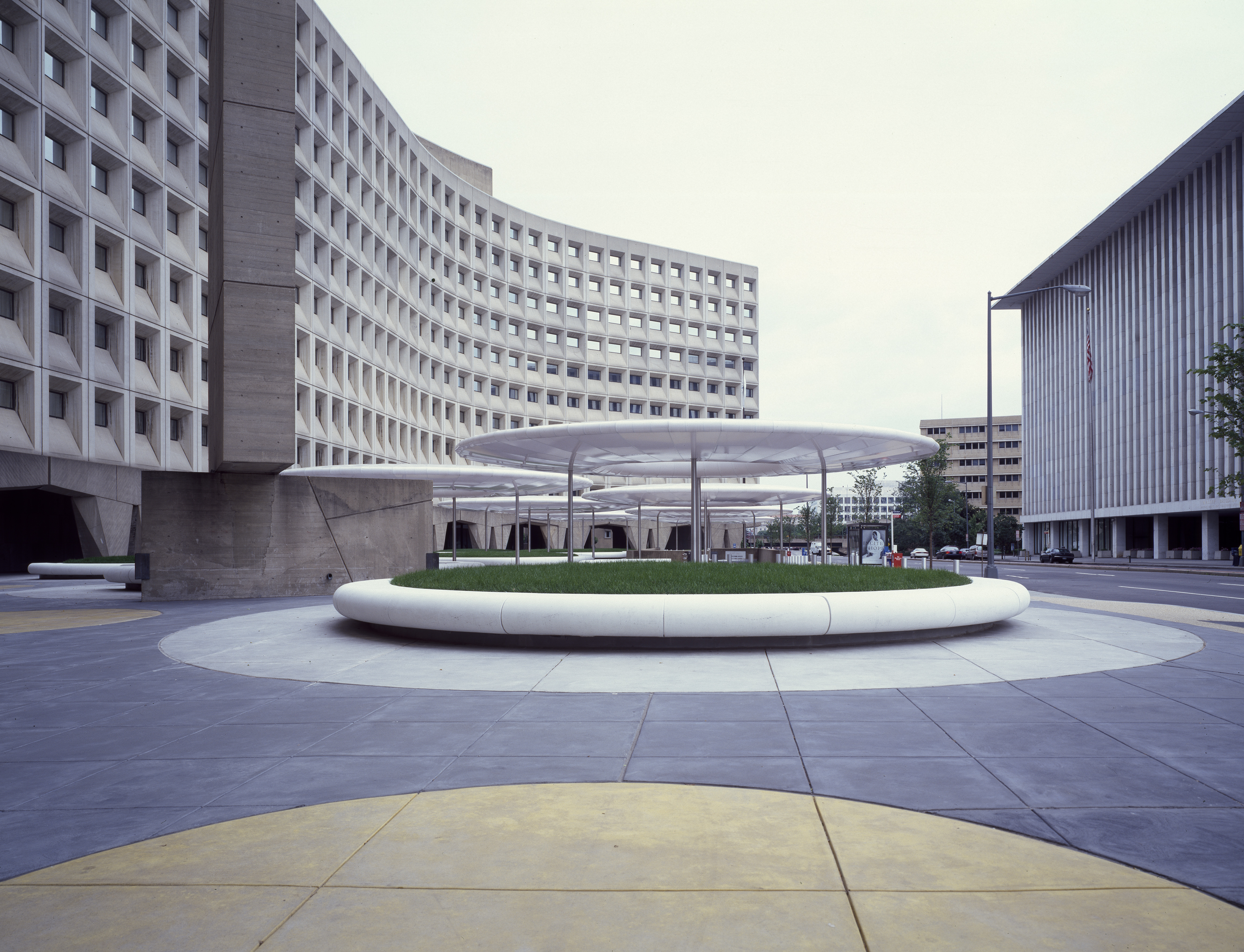 The headquarters of the Department of Housing and Urban Development, a brutalist building with circular canopies in its plaza.