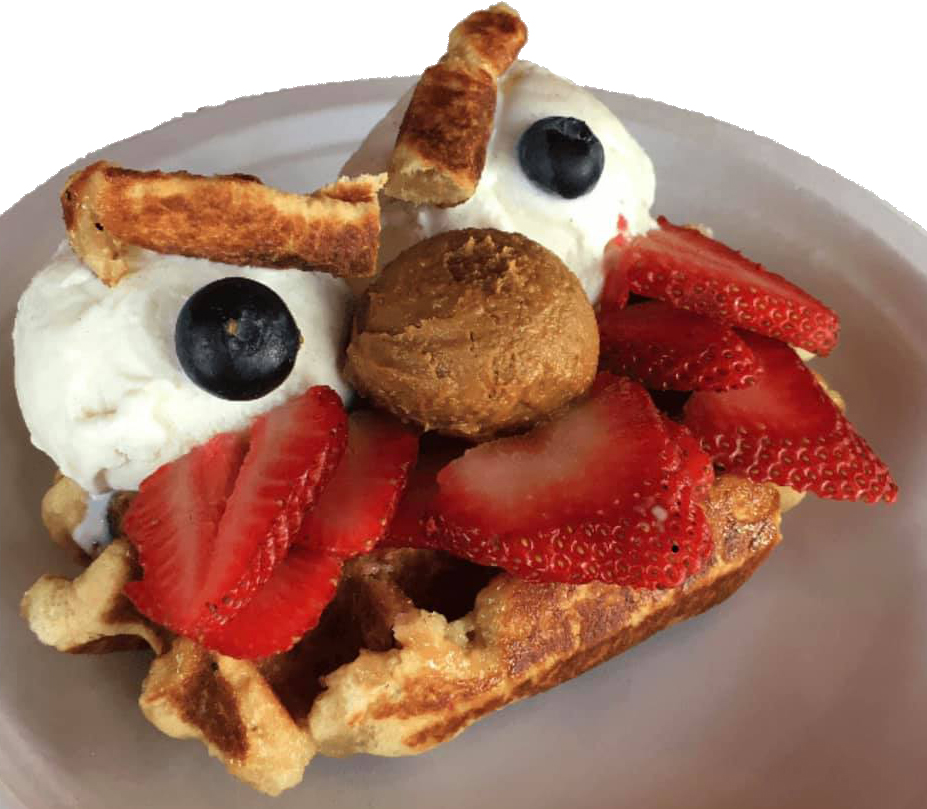 A “waffle monster” dessert, created with ice cream, strawberries and and a waffle.