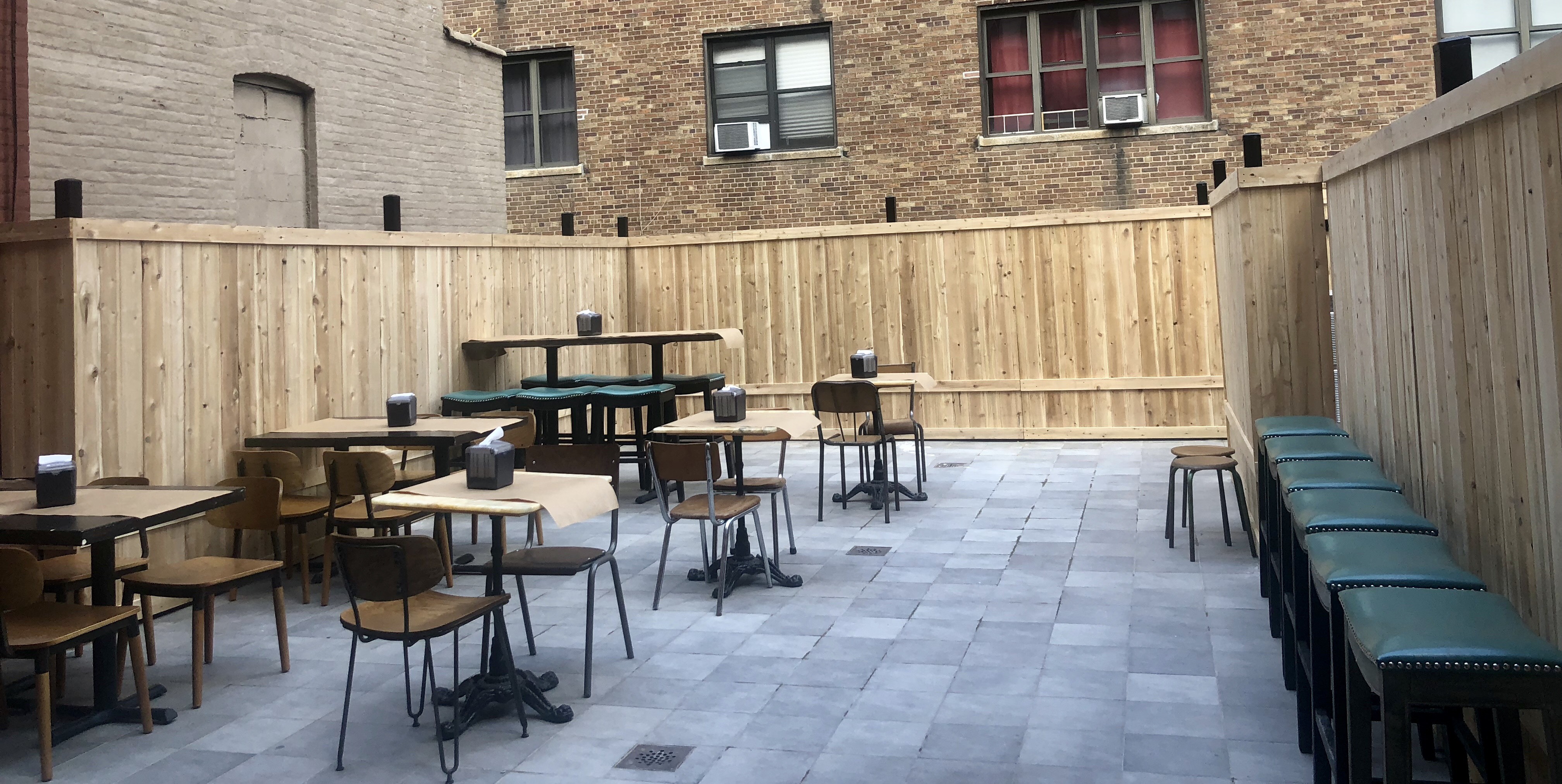 The outdoor patio with chairs and tables at Miznon North