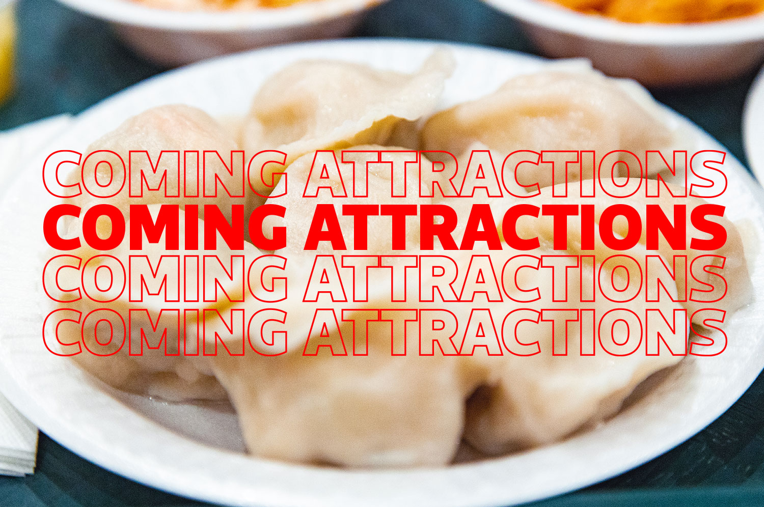 A Coming Attractions sign over dumplings